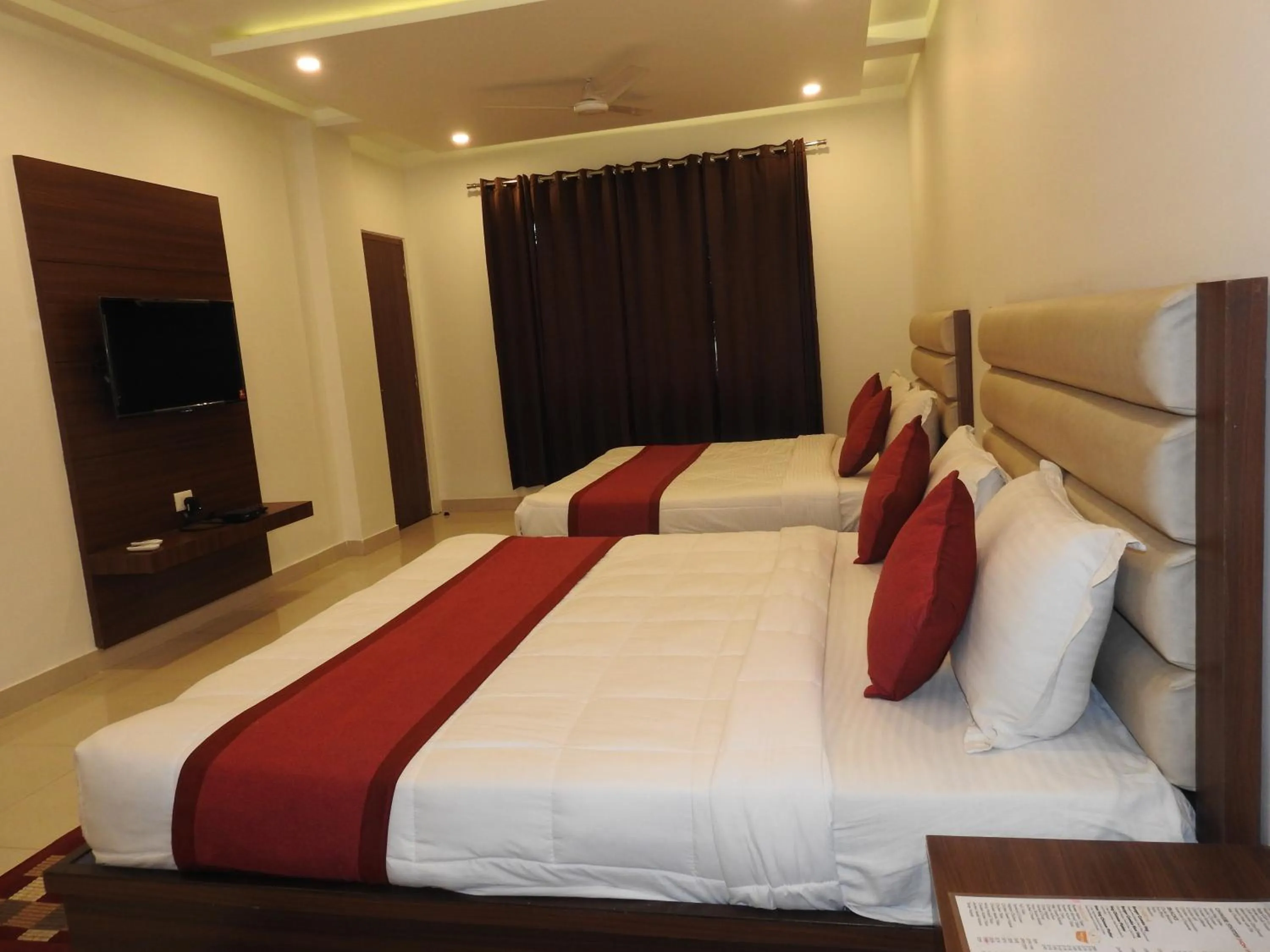 Bedroom in Hotel Aakash Residency