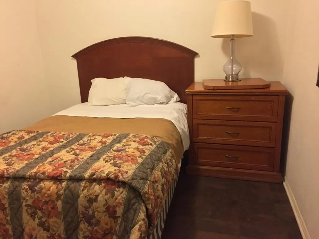 Bed in Ranch House Inn & Suites