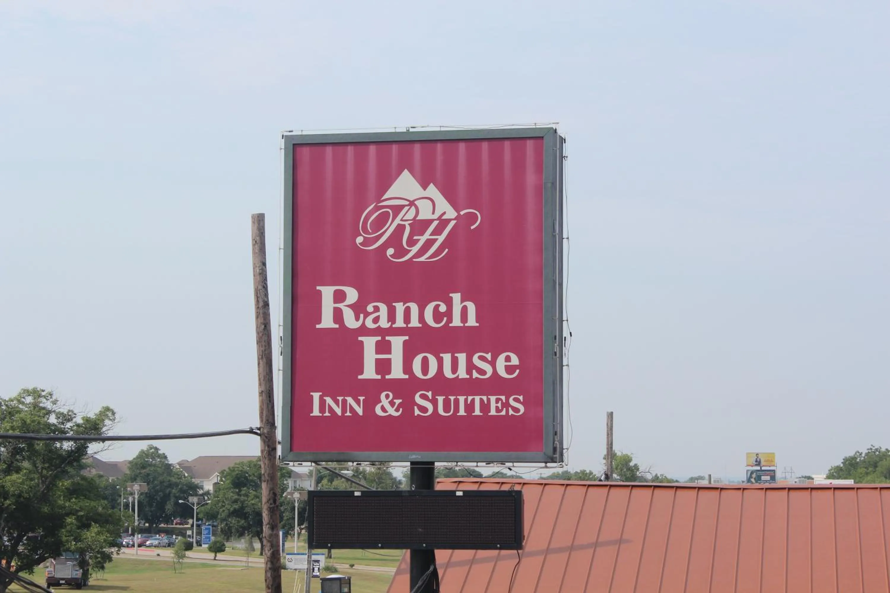 Property logo or sign in Ranch House Inn & Suites