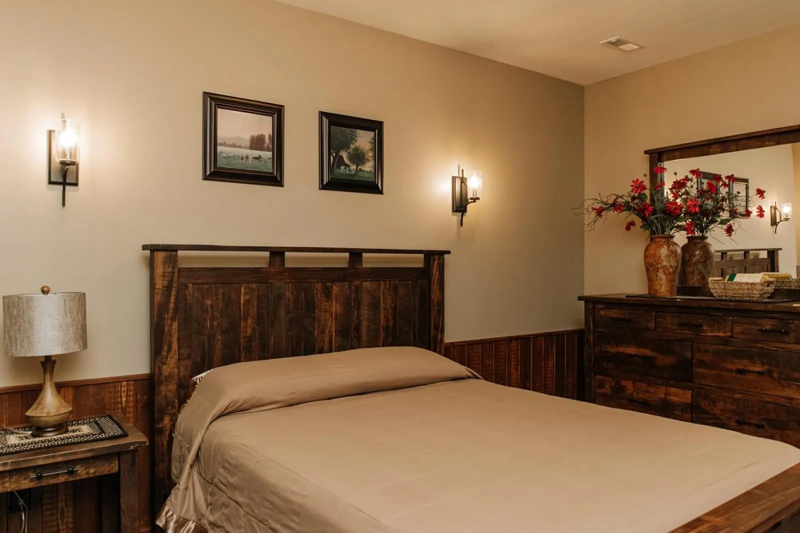 Bed in Sojourner's Lodge & Log Cabin Suites