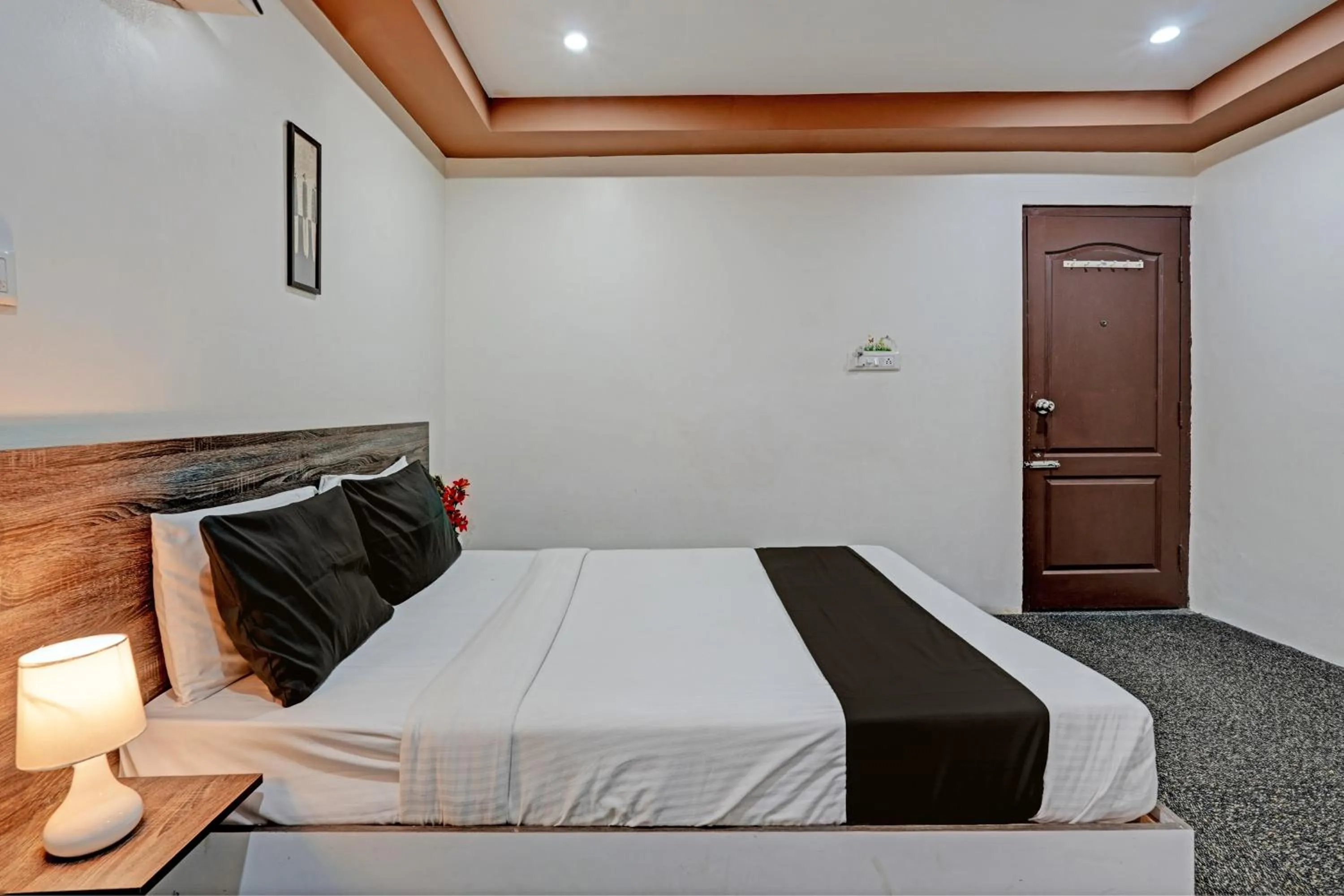 Bedroom in Hotel O Sri Sai sevalal comfort's