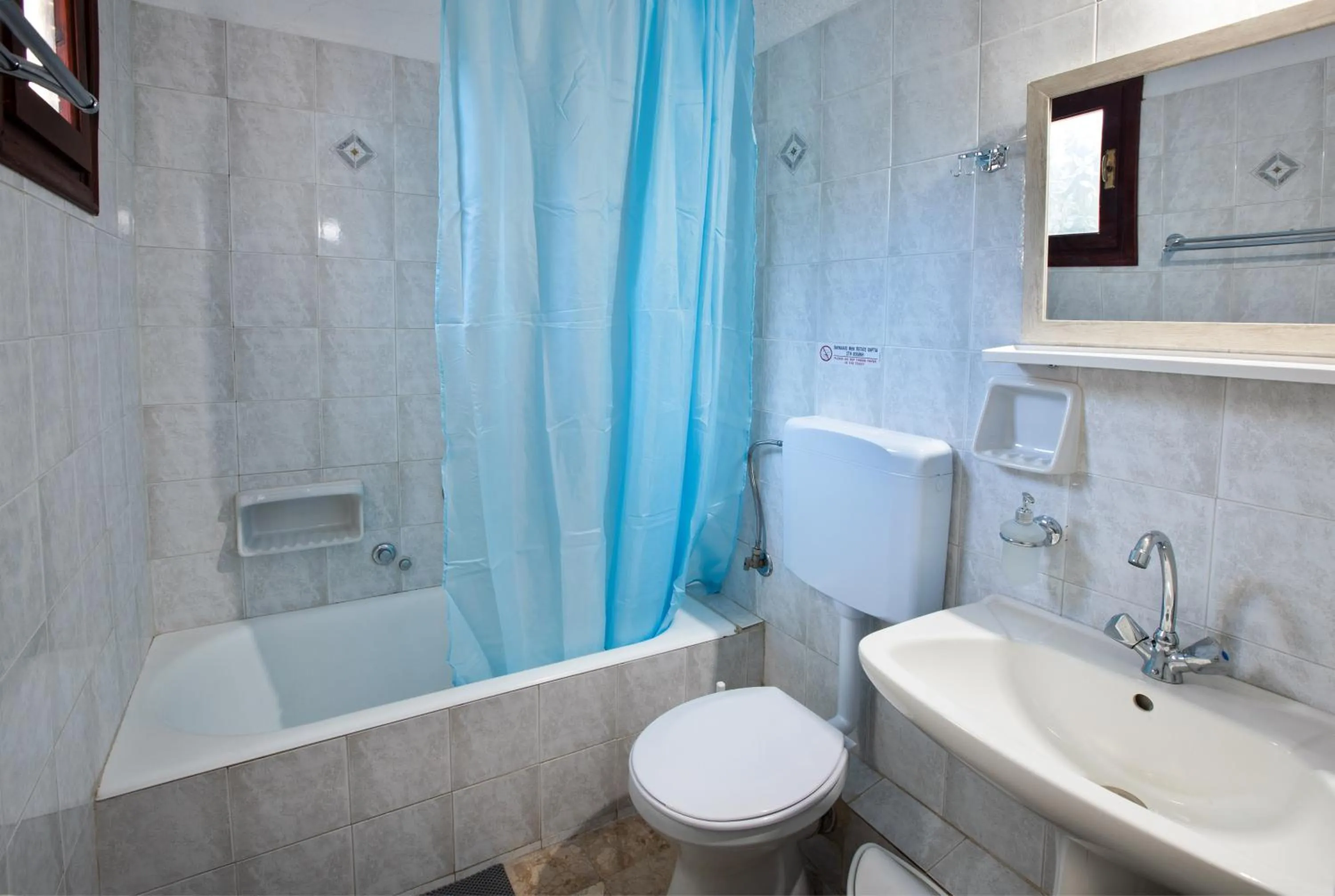 Toilet in New Aurora Apts Studios