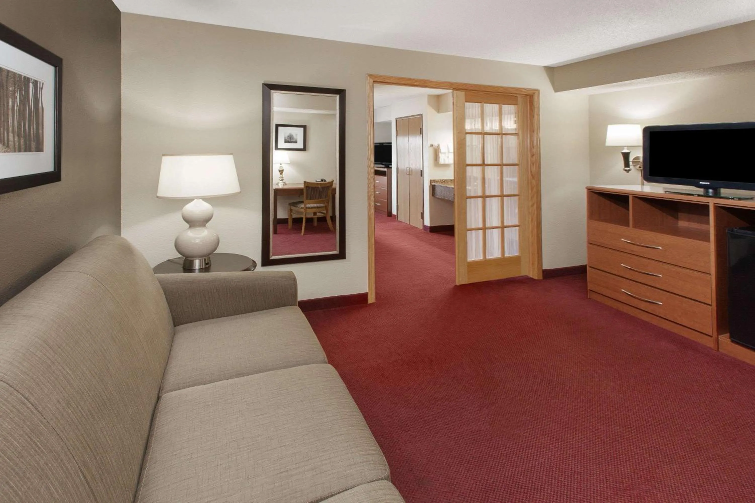 Living room in AmericInn by Wyndham Iowa Falls