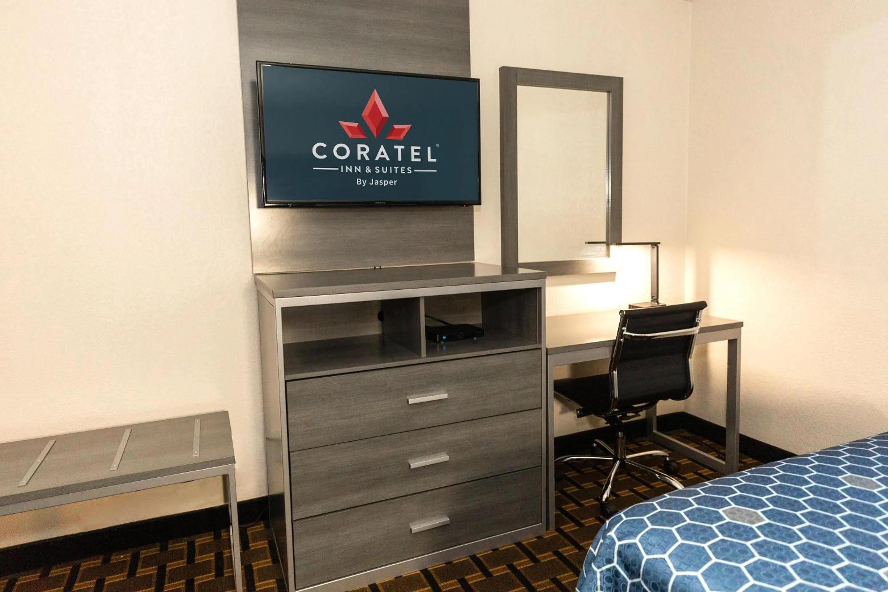 Bed in Coratel Inn & Suites by Jasper Mankato