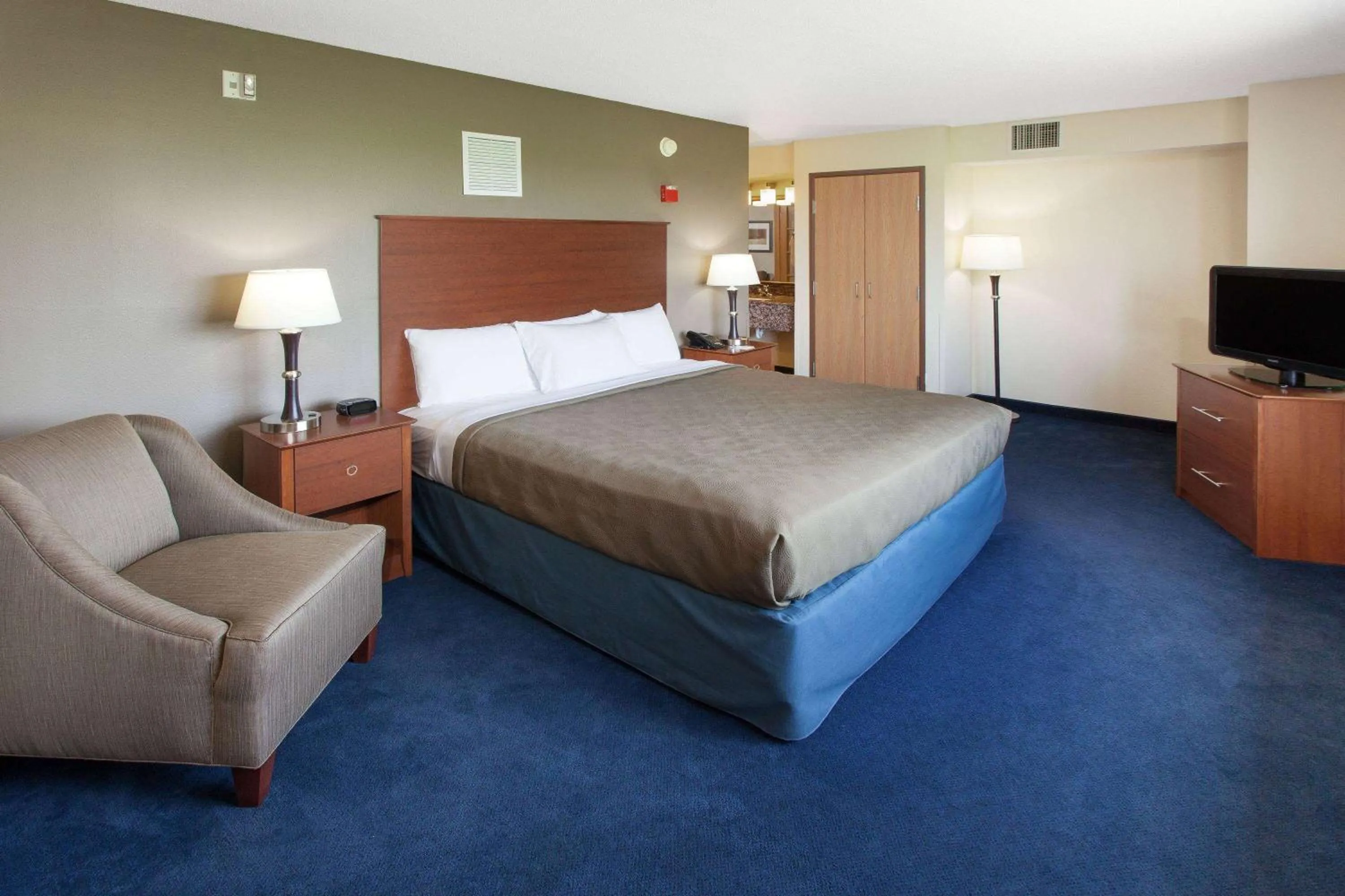 Bed in AmericInn by Wyndham Webster City