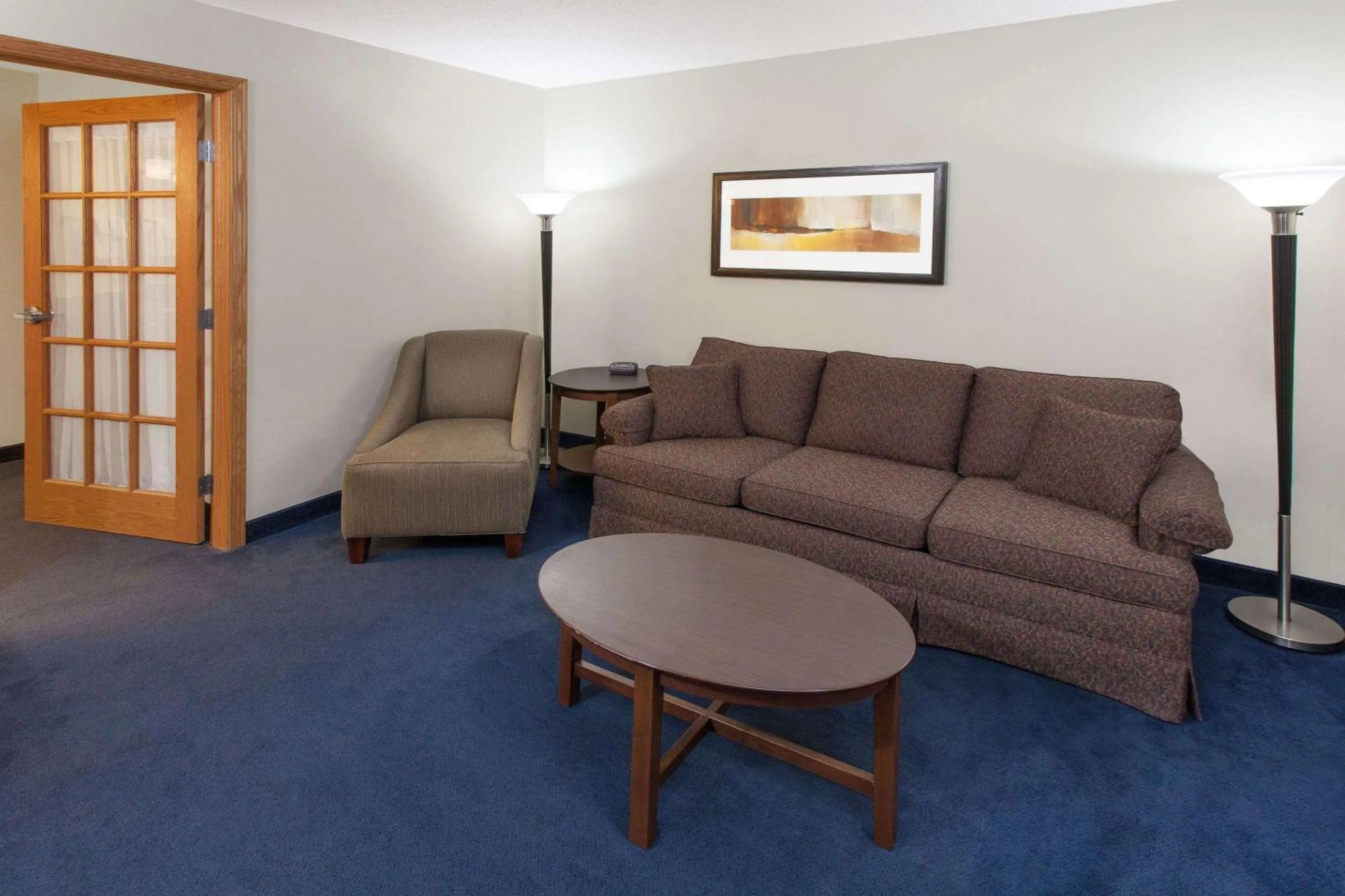 Living room in AmericInn by Wyndham Webster City