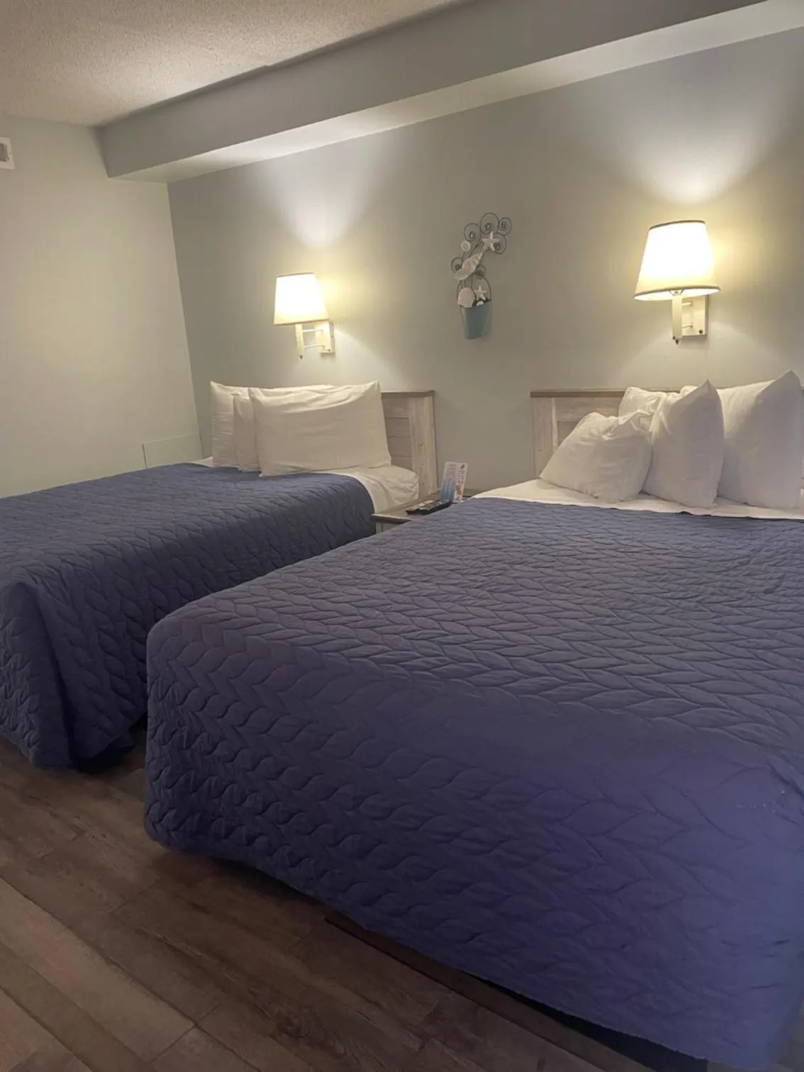 Bed in Acacia Beachfront Resort