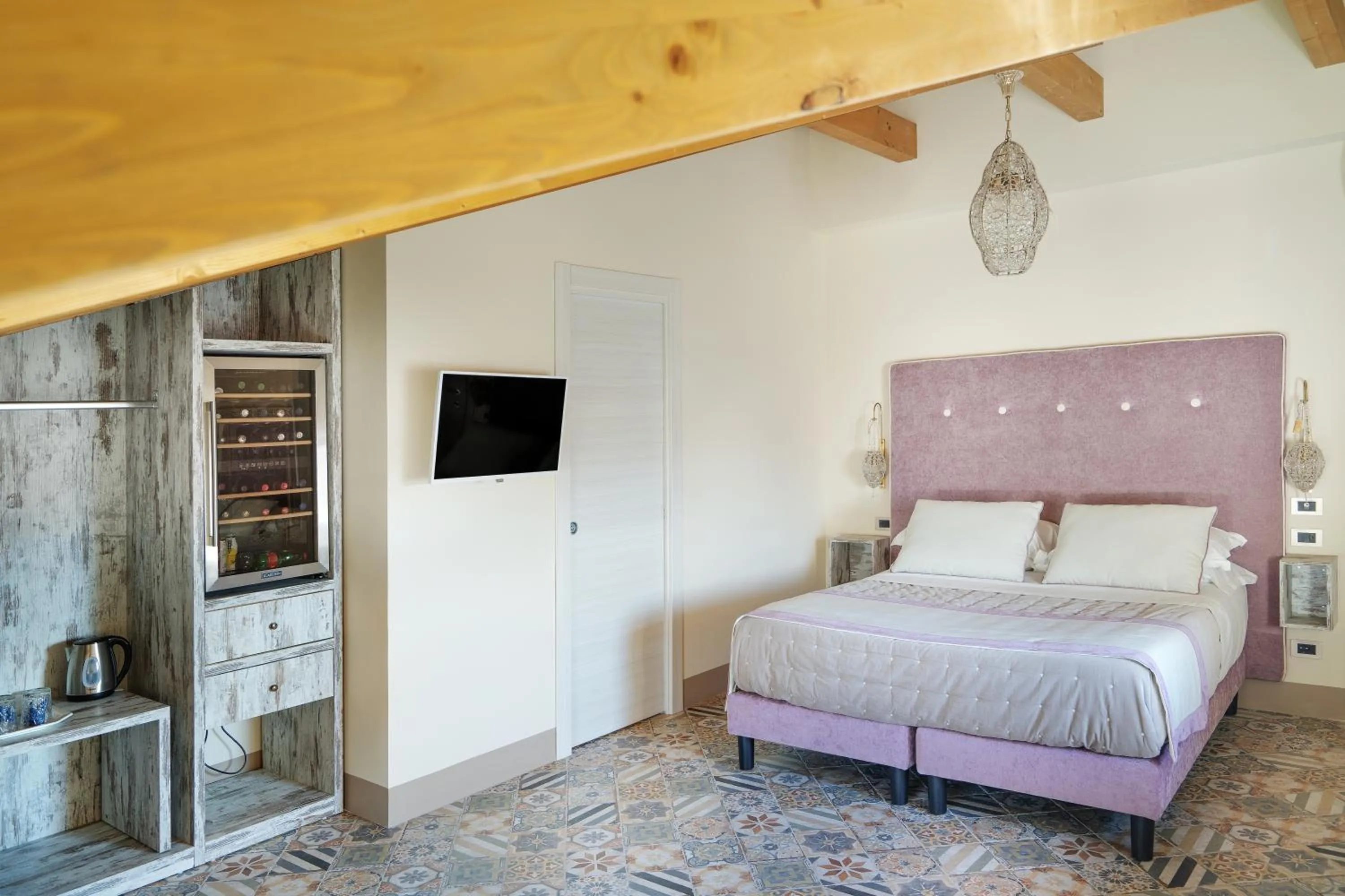 Bed in DON GIULIO LUXURY ROOMS jacuzzi