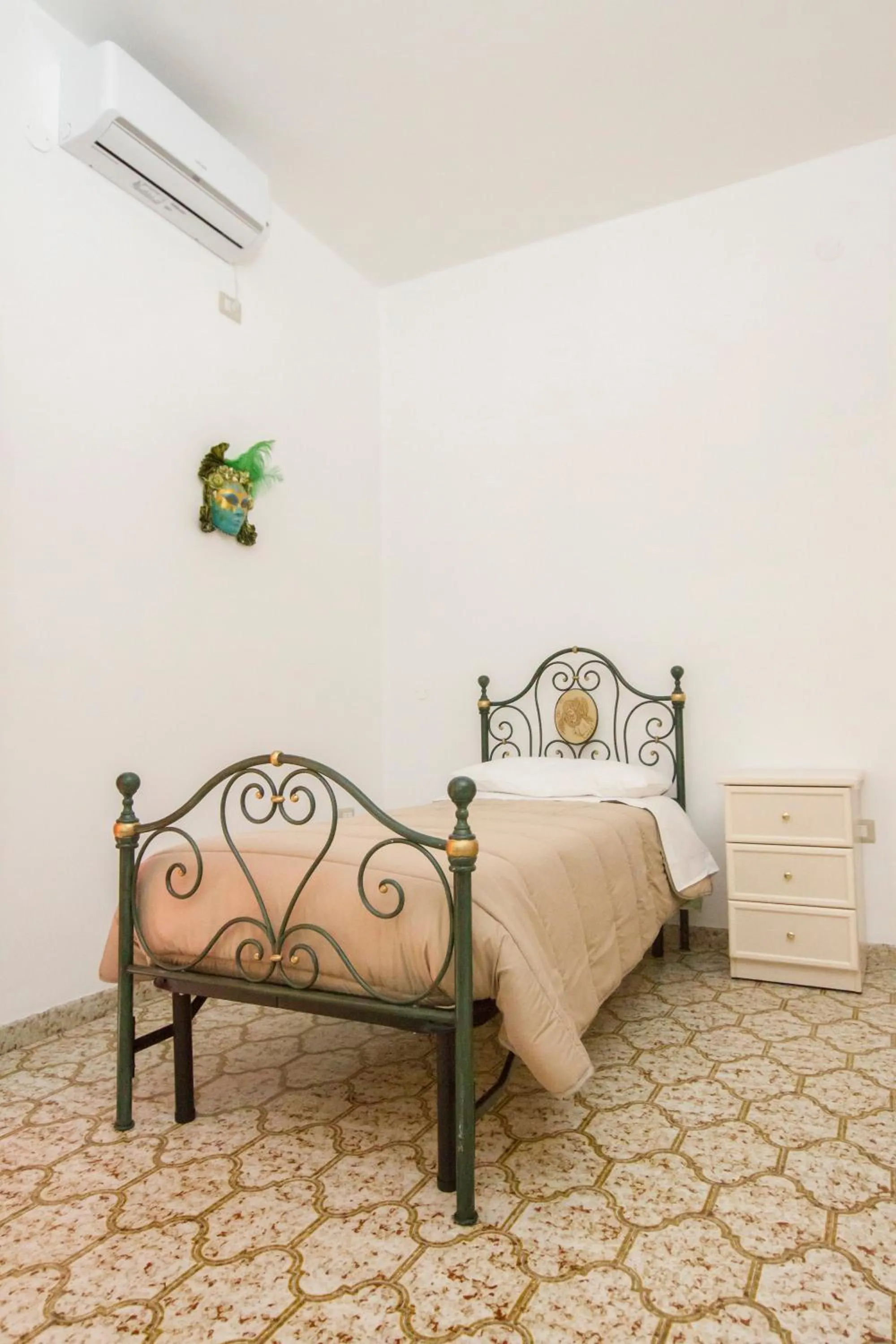 Bed in Le Maschere B&B