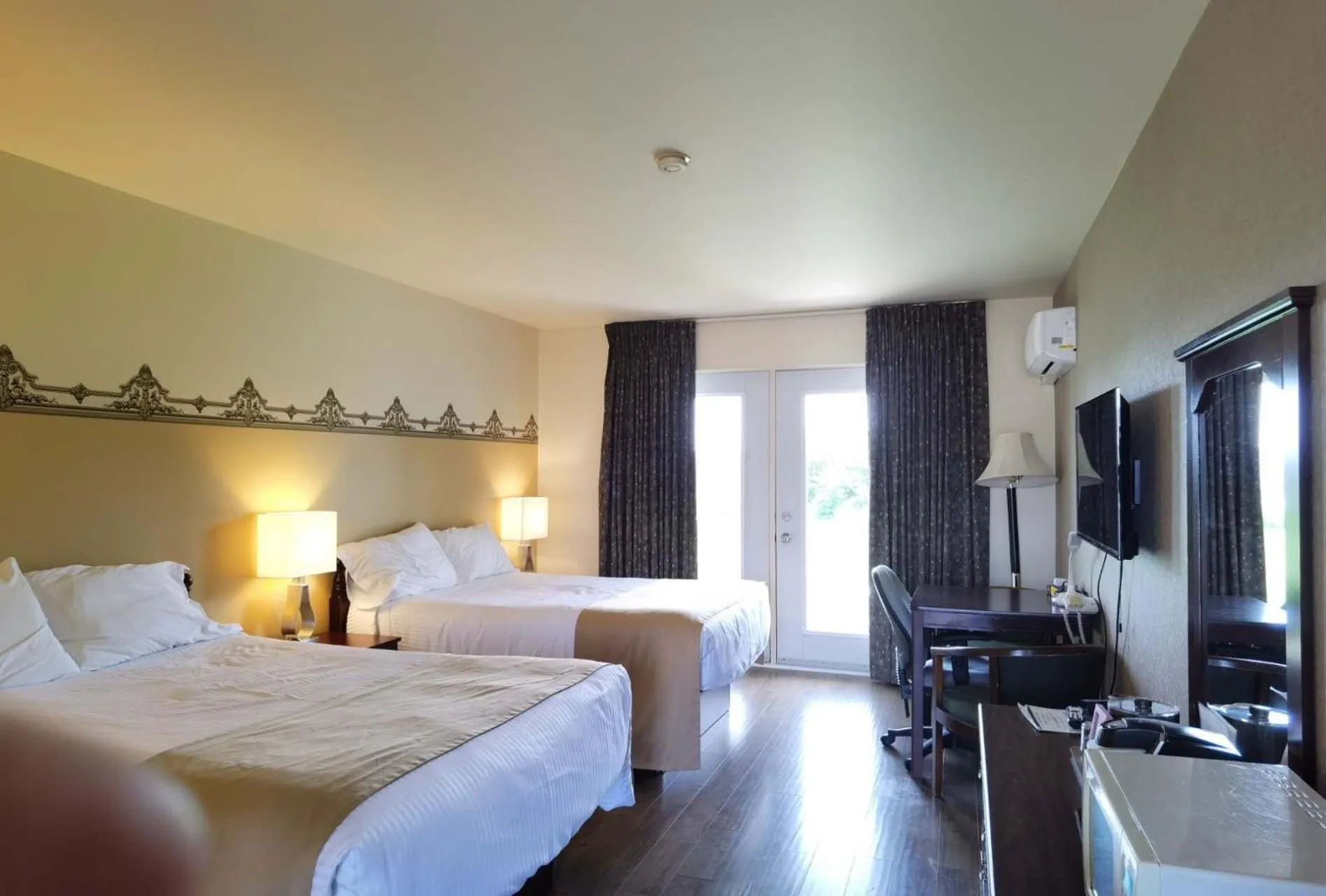 Bed in Motel Grand-Pré Inc