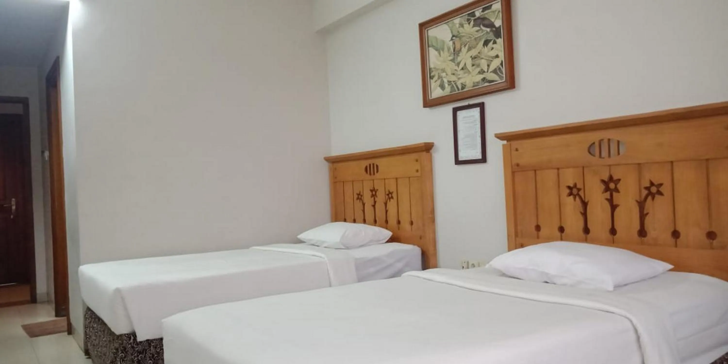 Bed in Hotel Yehezkiel Surapati Mitra RedDoorz