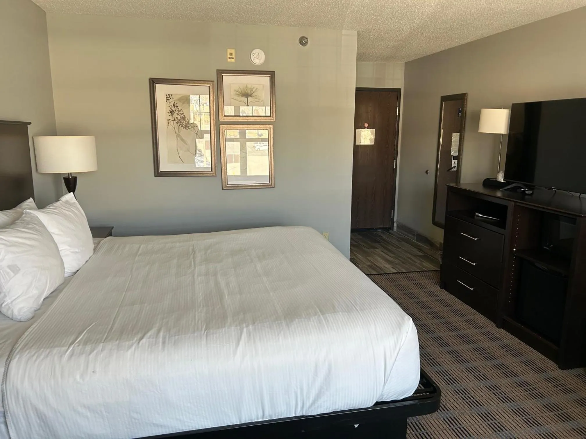 Bed in AmericInn by Wyndham Ottumwa