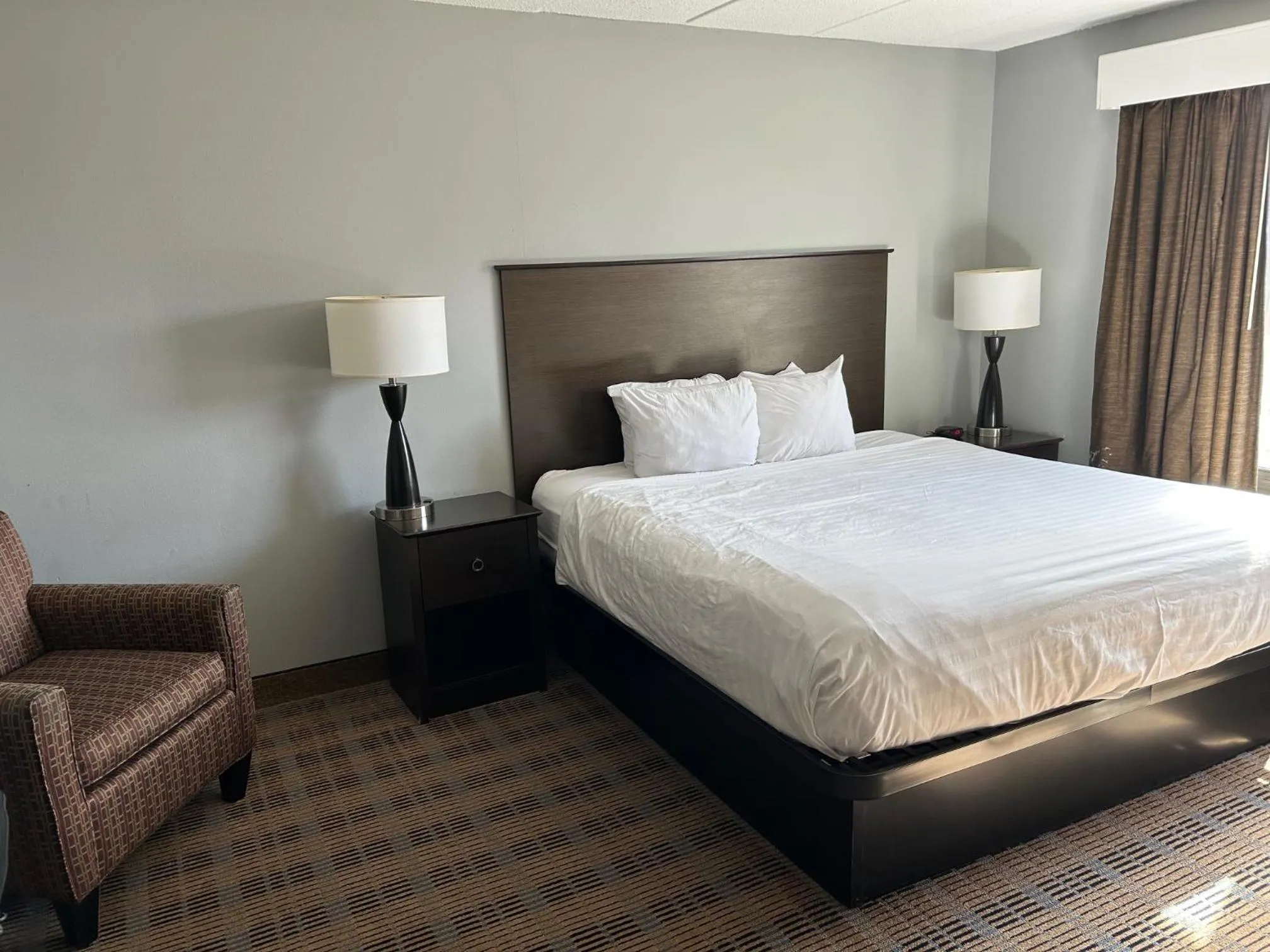 Bed in AmericInn by Wyndham Ottumwa