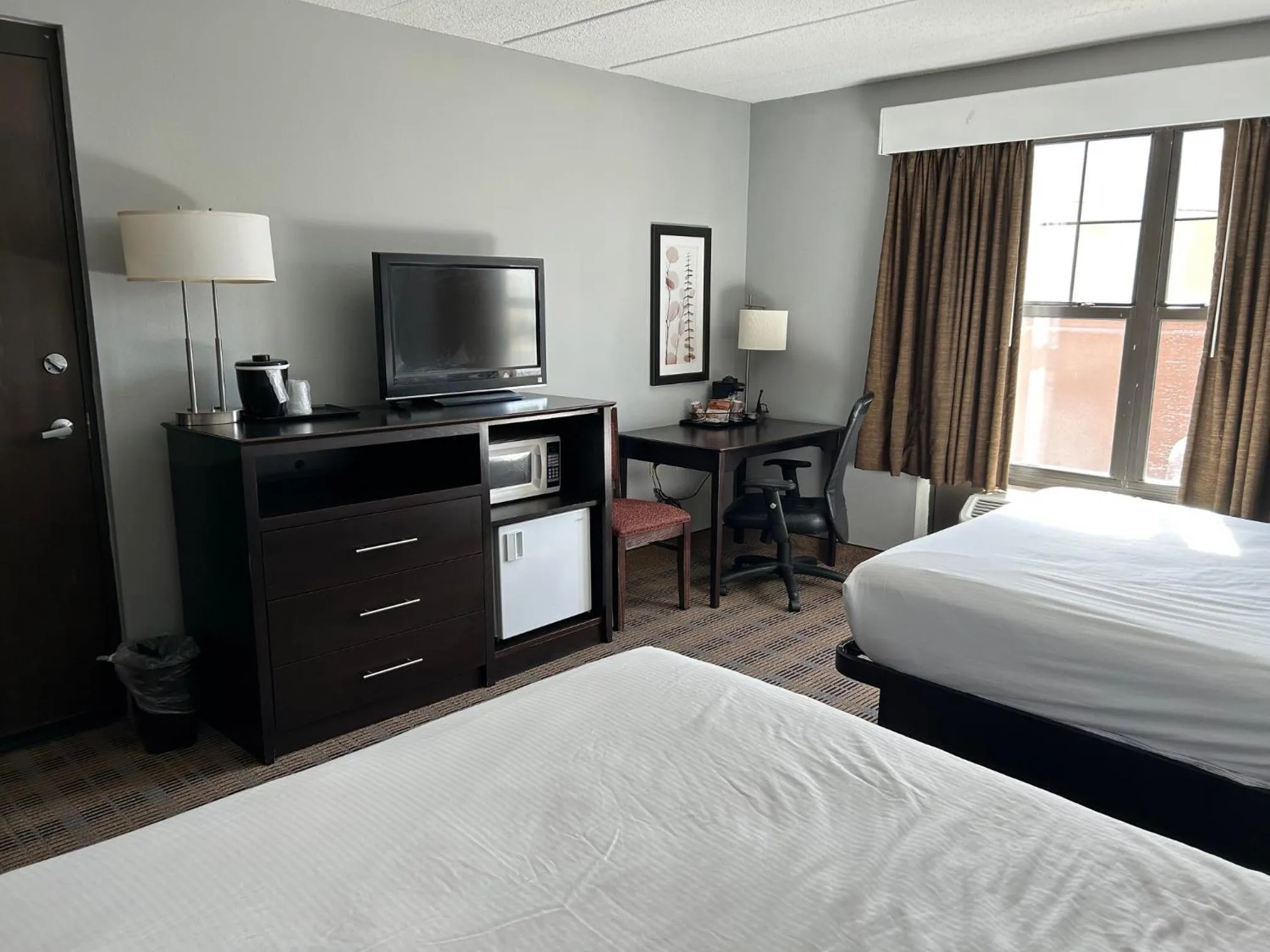 Bed in AmericInn by Wyndham Ottumwa