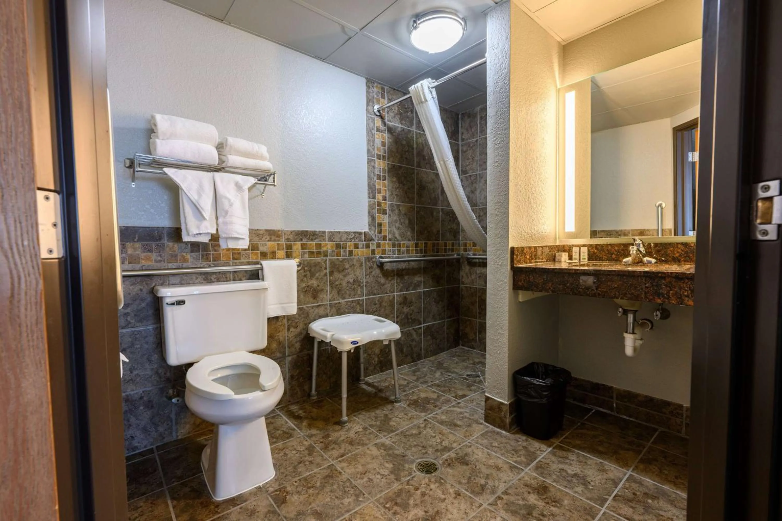 Bathroom in AmericInn by Wyndham Monroe