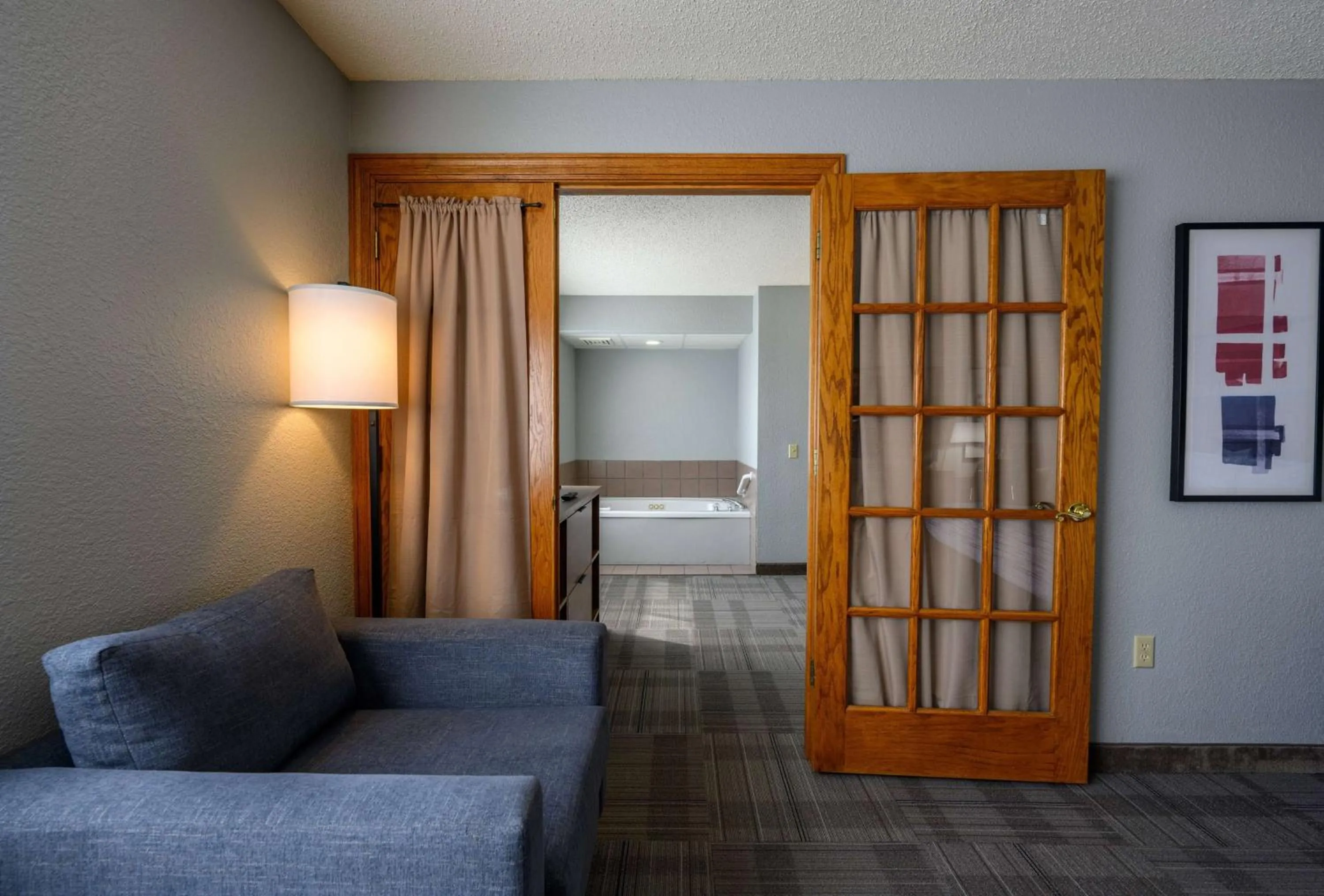 Bathroom, Bed in AmericInn by Wyndham Monroe