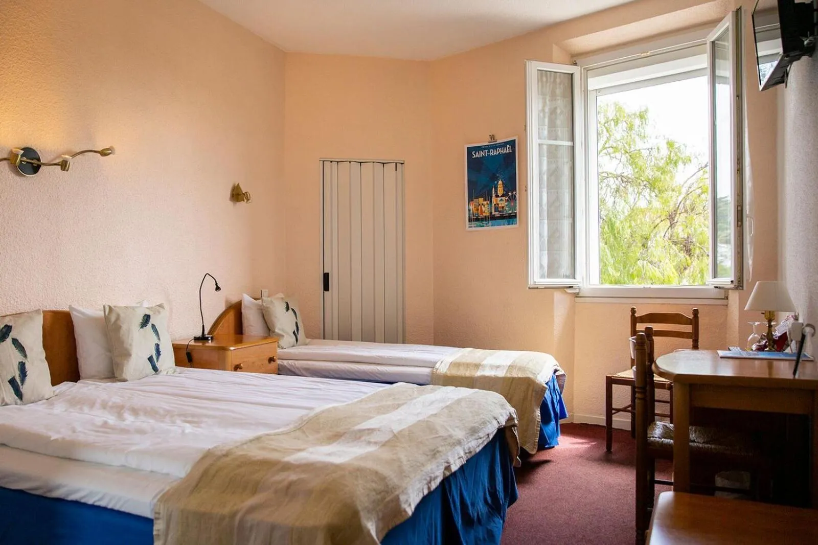 Photo of the whole room, Bed in Hôtel Du Soleil