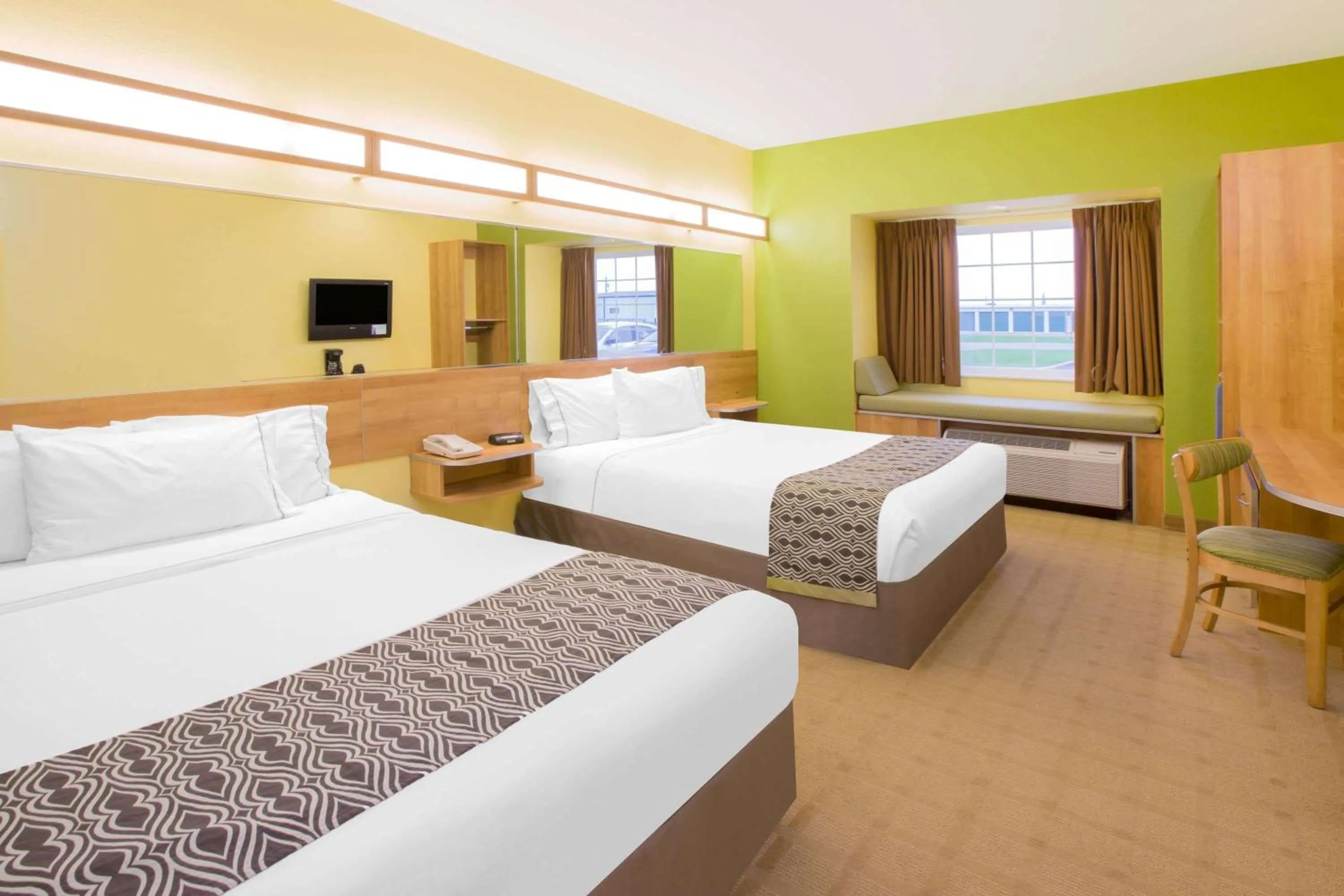 Photo of the whole room, Bed in Microtel Inn & Suites by Wyndham Delphos