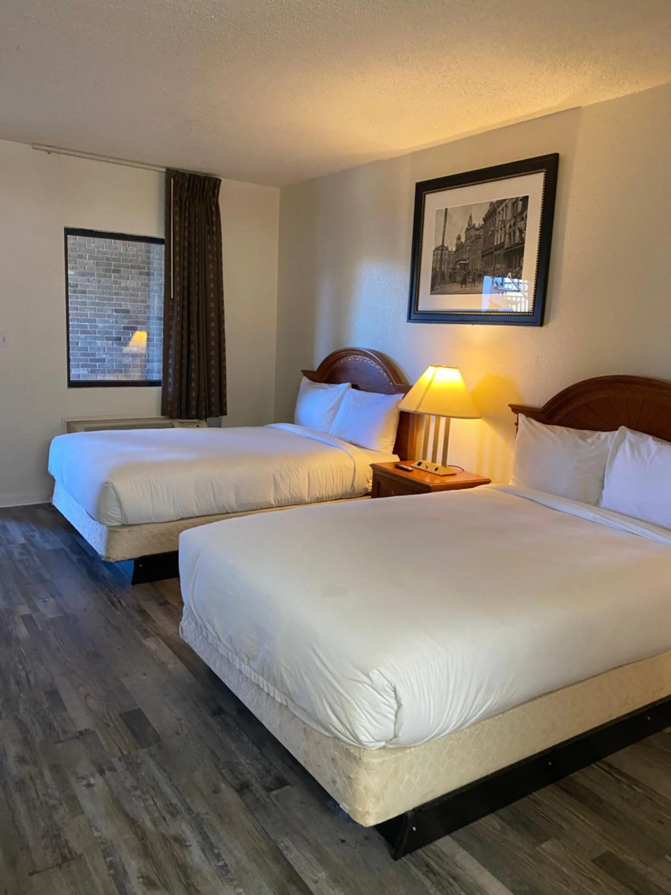 Bed in Traveler's Place Inn & Suites