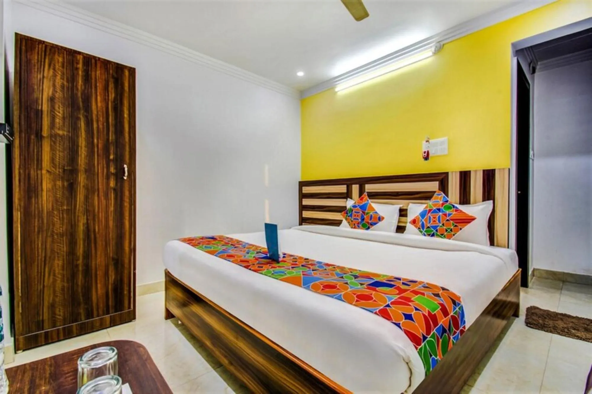 Bed in FabHotel Grand Sheela