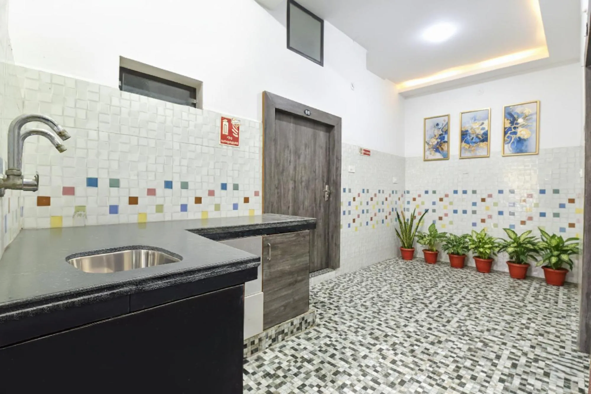 Kitchen or kitchenette in FabHotel Soni Palace