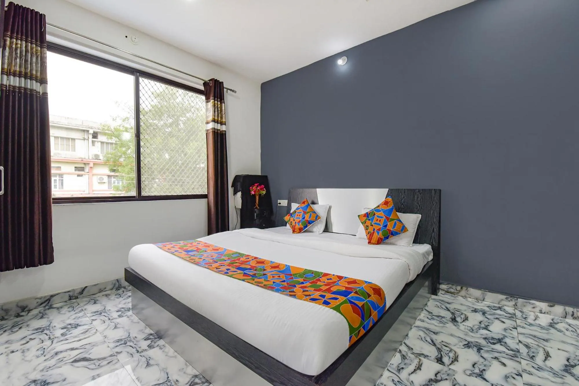 Bed in FabHotel Soni Palace