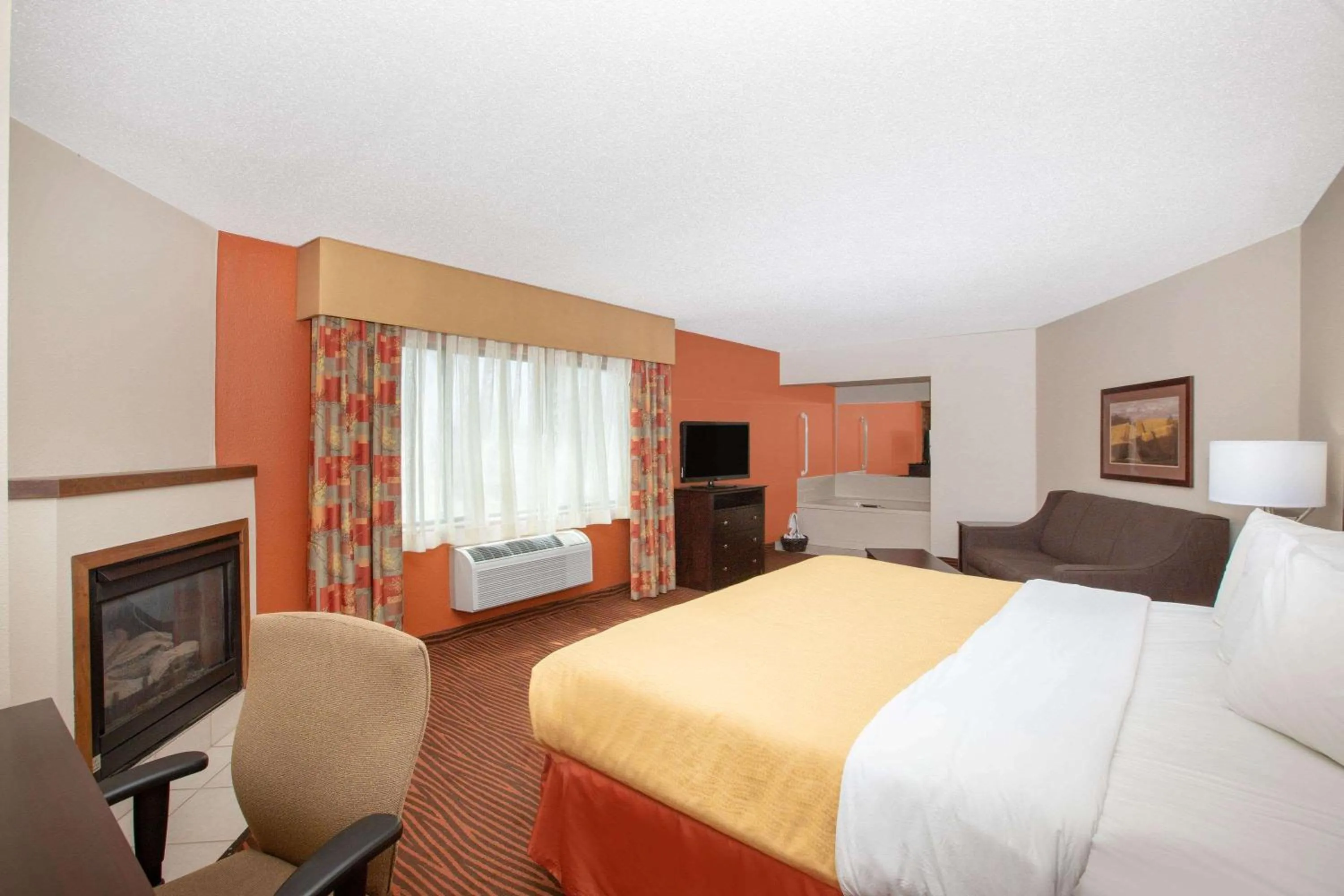Photo of the whole room, Bed in AmericInn by Wyndham Muscatine