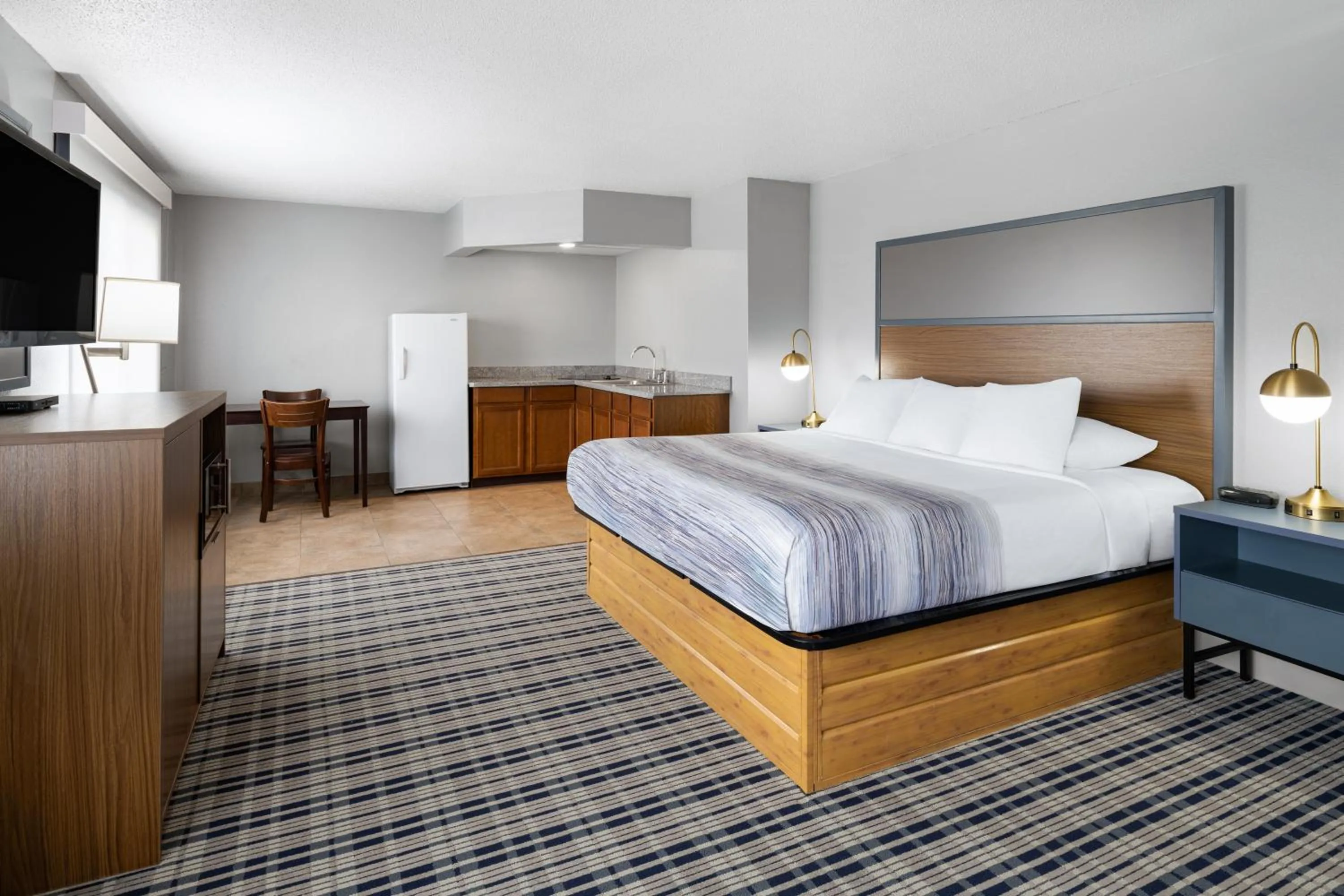Bed in AmericInn by Wyndham Muscatine
