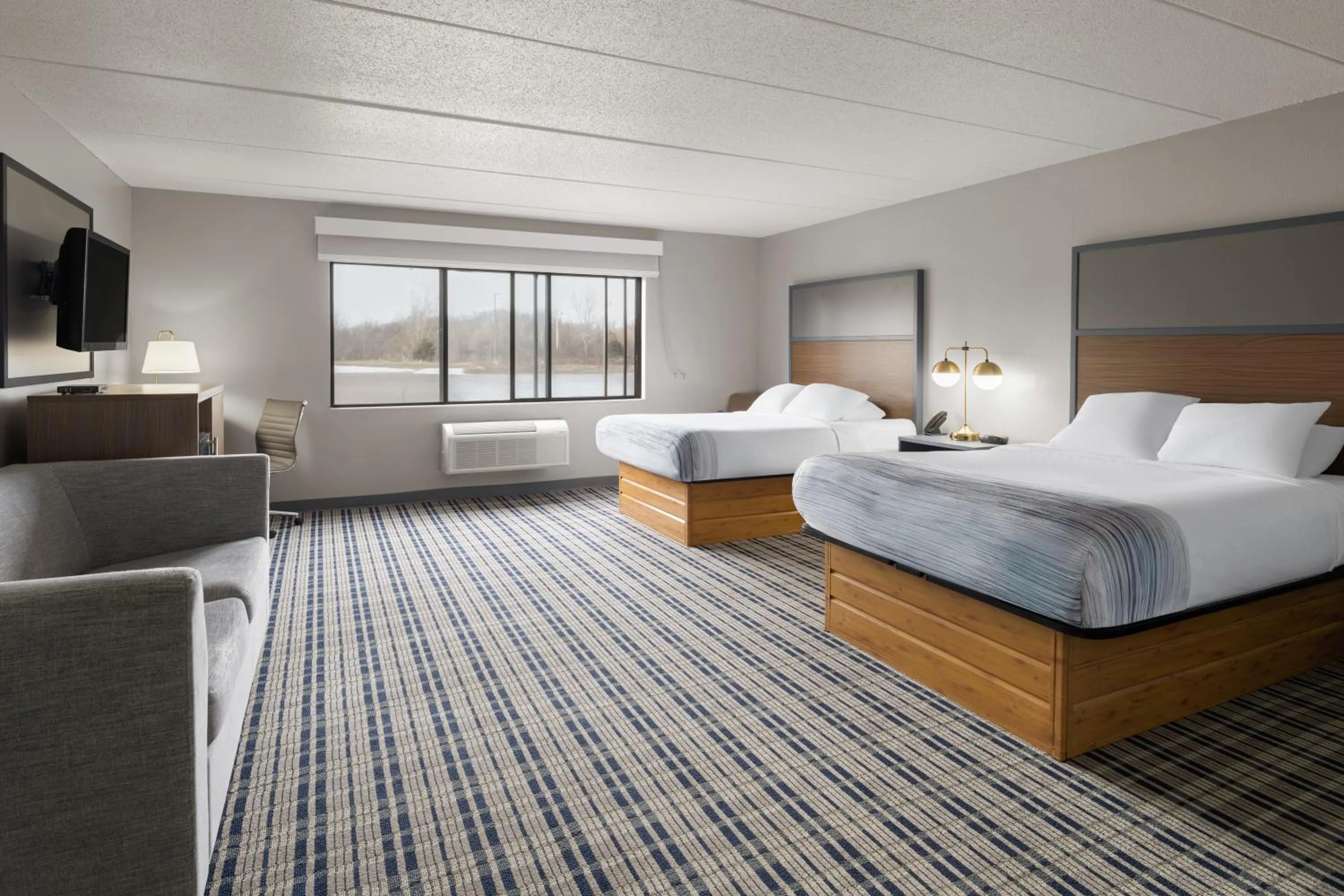 Bed in AmericInn by Wyndham Muscatine