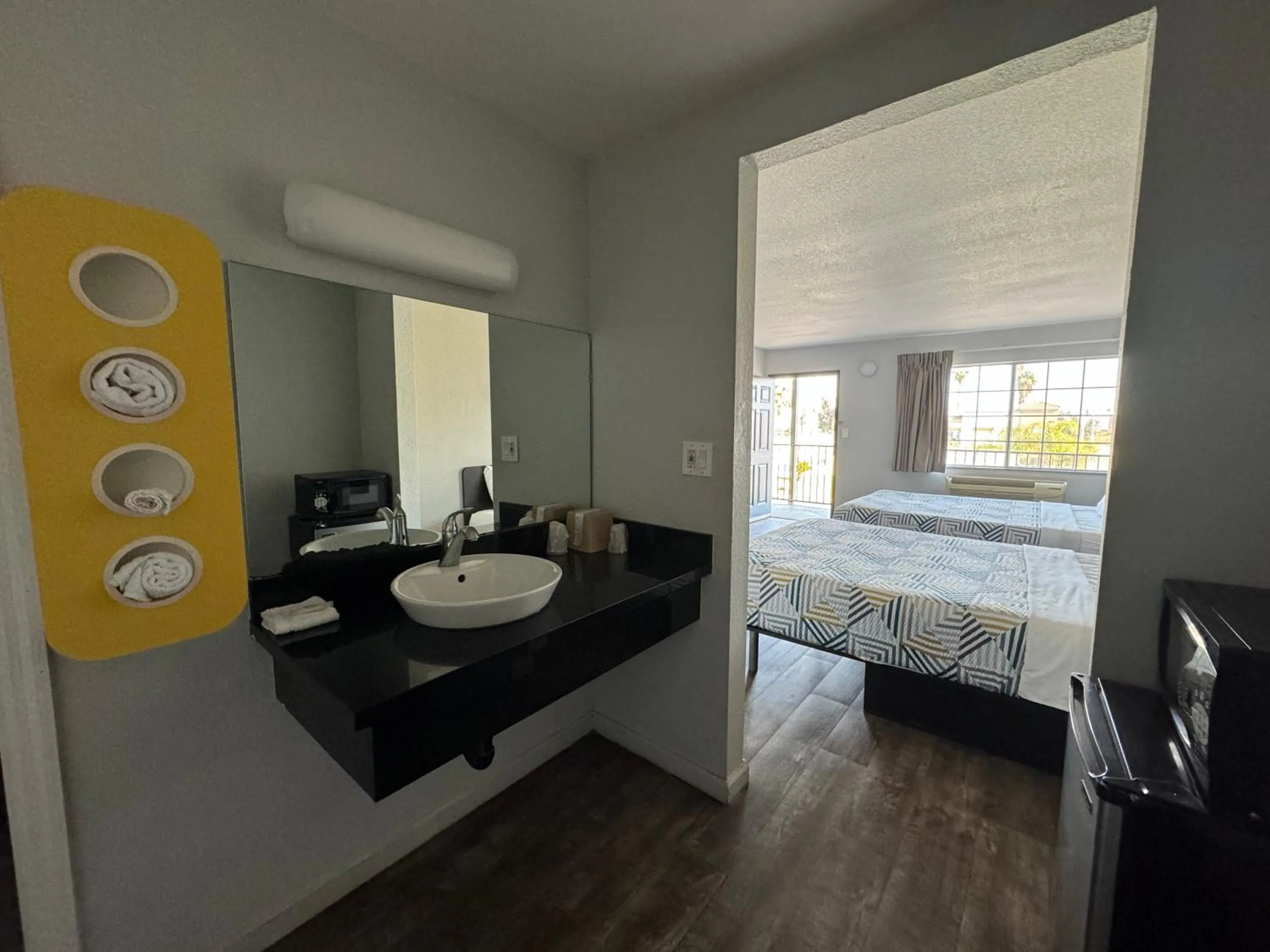 Bathroom, Bed in Motel 6-Delano, CA