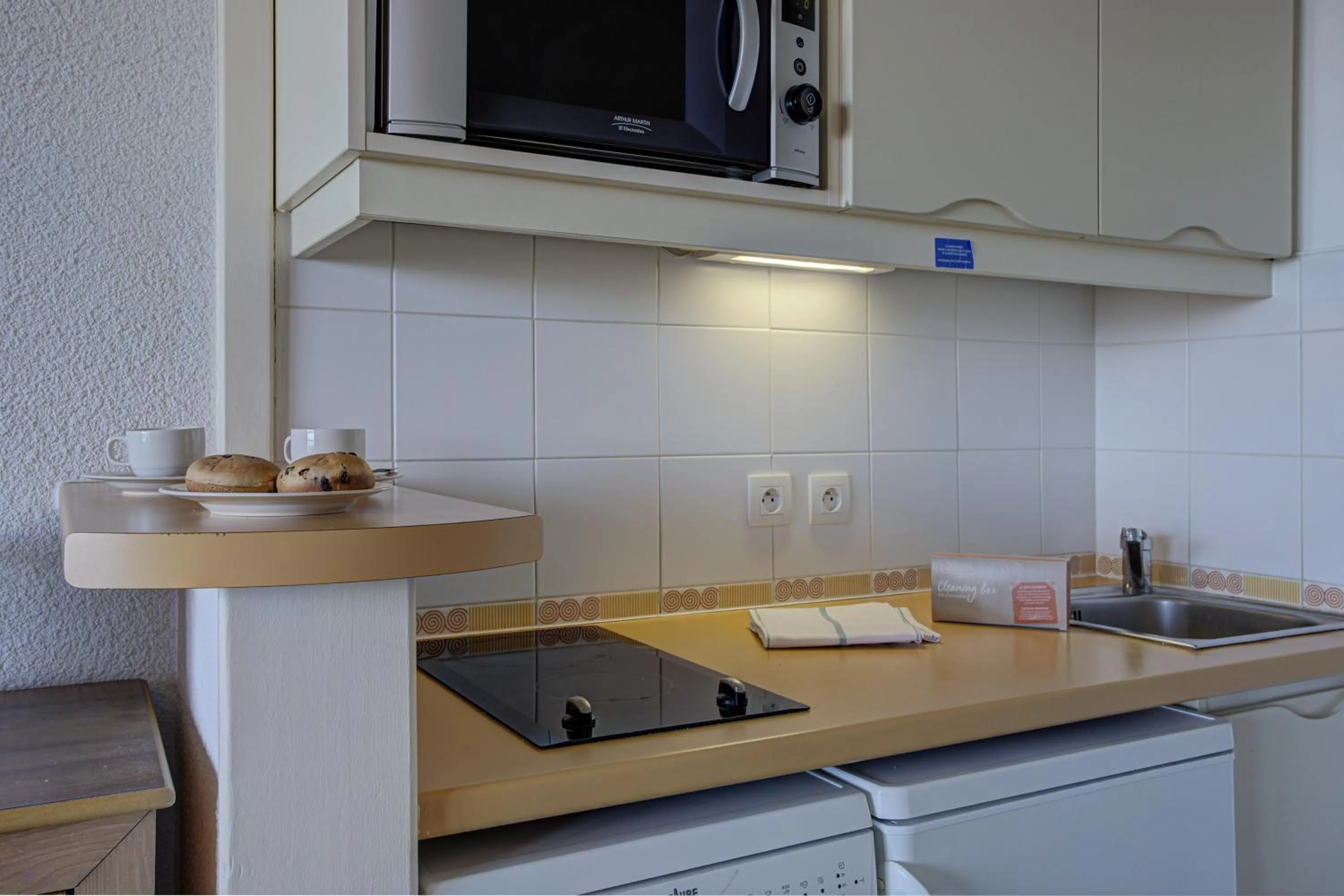 Kitchen or kitchenette in Résidence Pierre & Vacances Le Pédrou