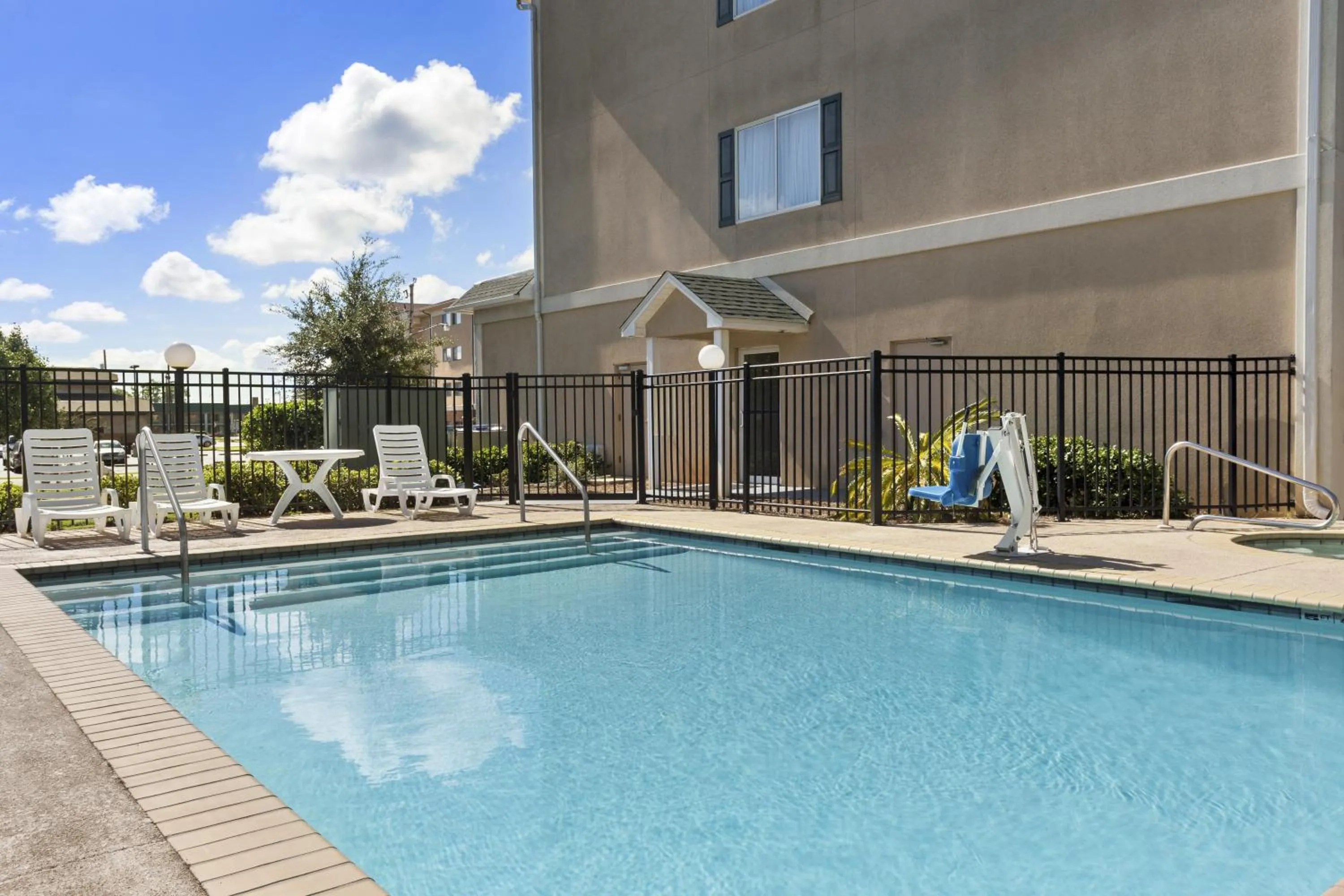 Pool view in Country Inn & Suites by Radisson, Saraland, AL