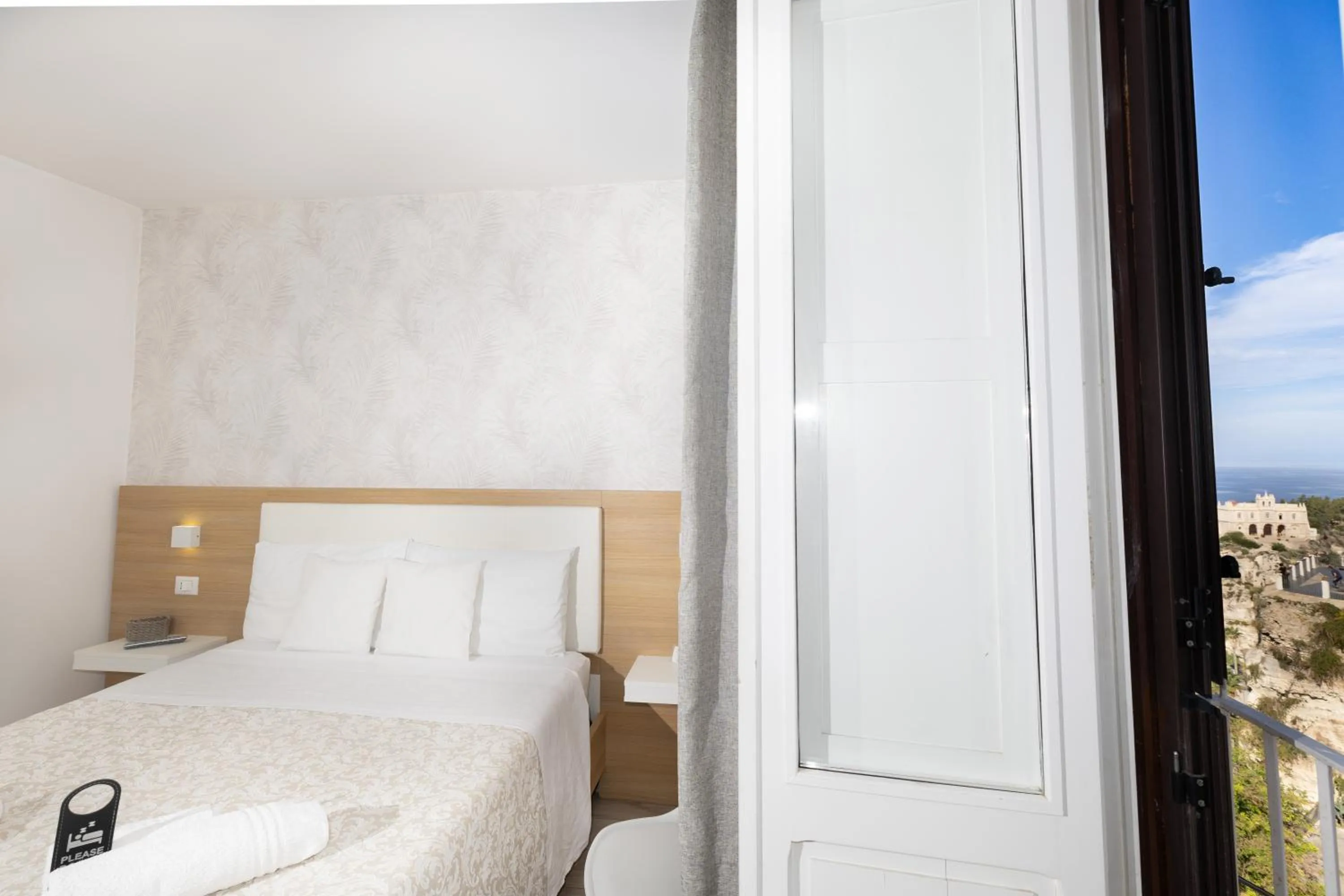 Bed in B&B Island Tropea -Sea View Rooms & Suites-