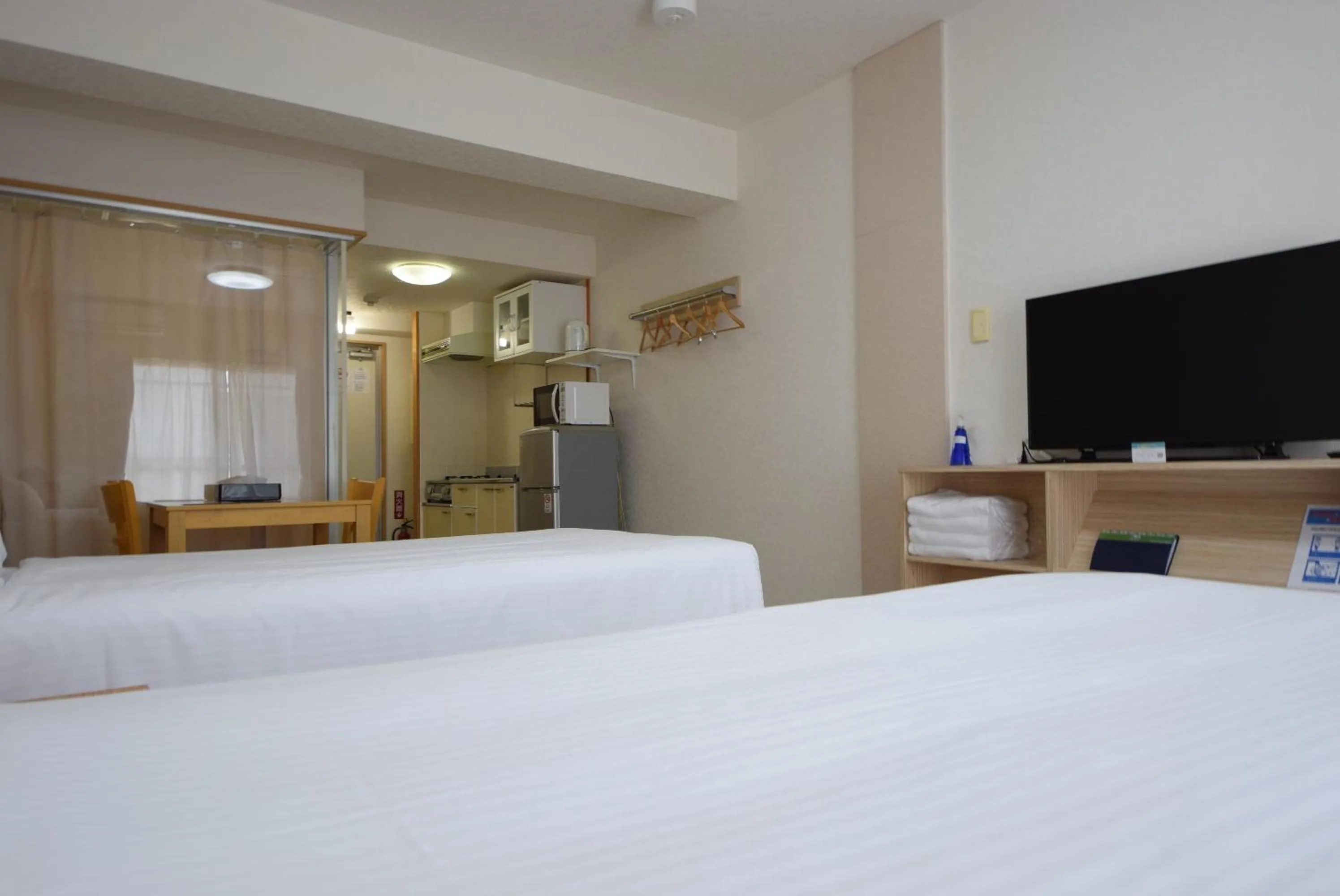 Photo of the whole room, TV/Entertainment Center in STAY IN SUMUKA Kokusai Street