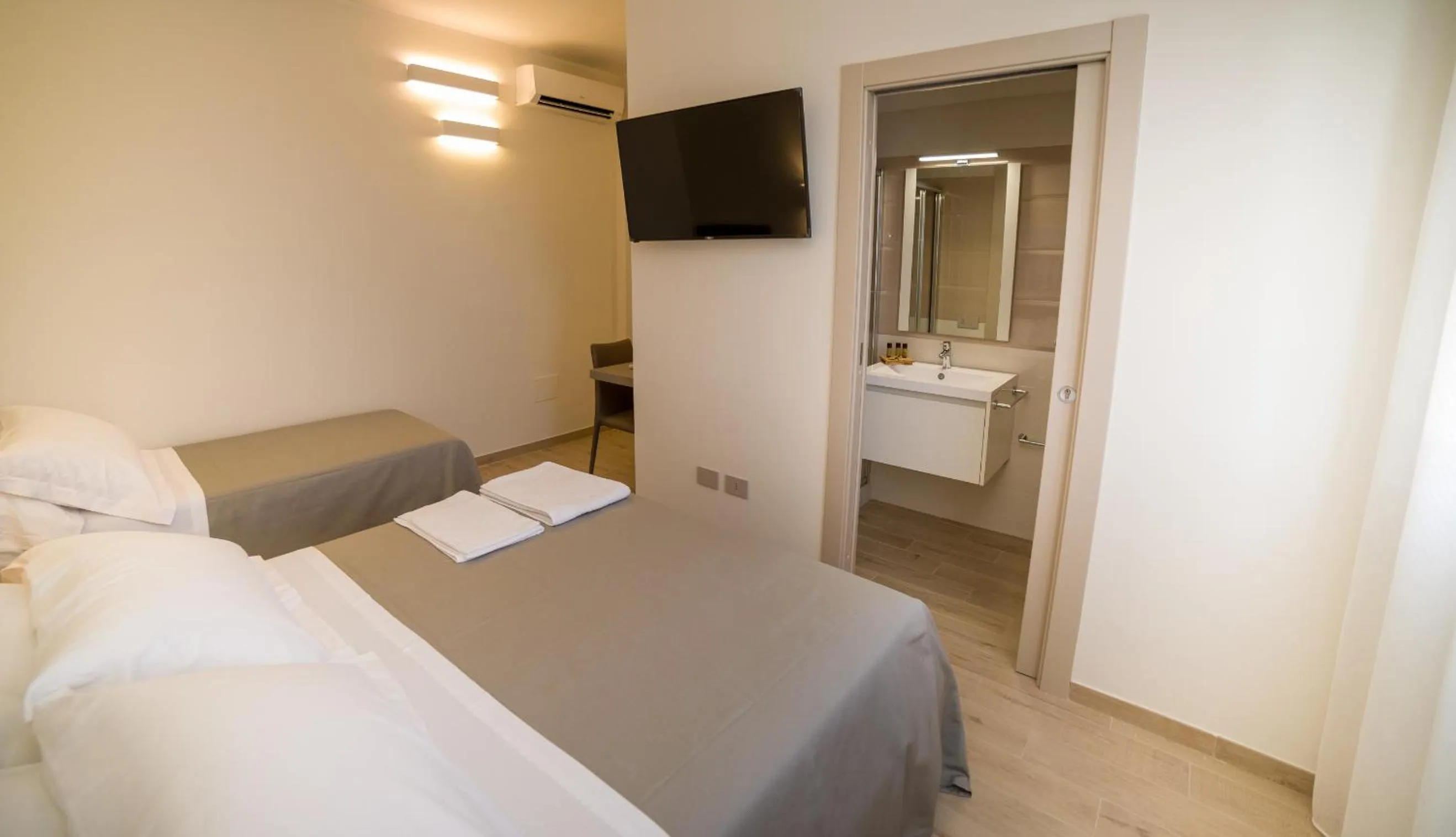 Bed in kamilia guestrooms