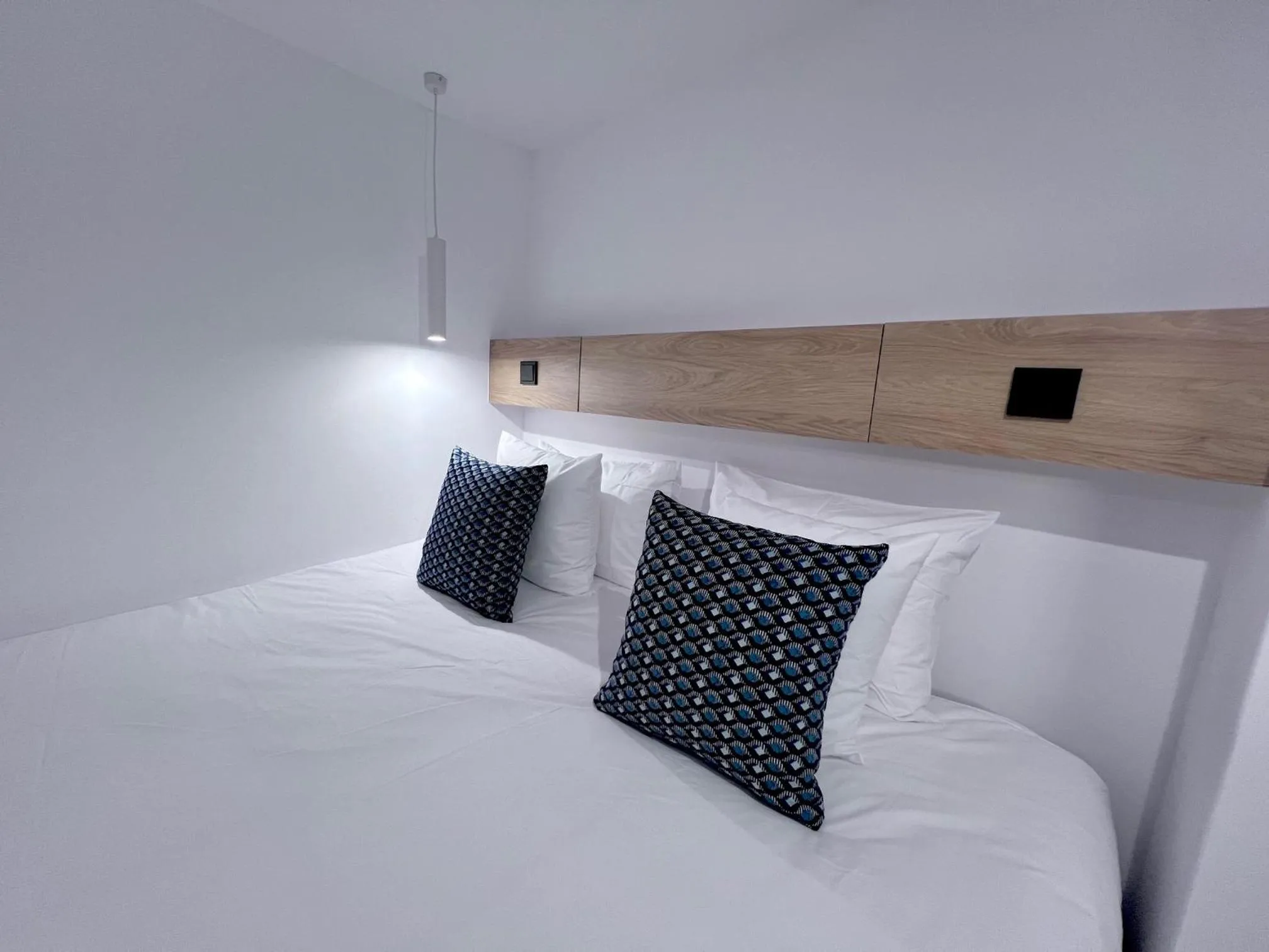 Bed in PINACOTA SUITES ATHENS