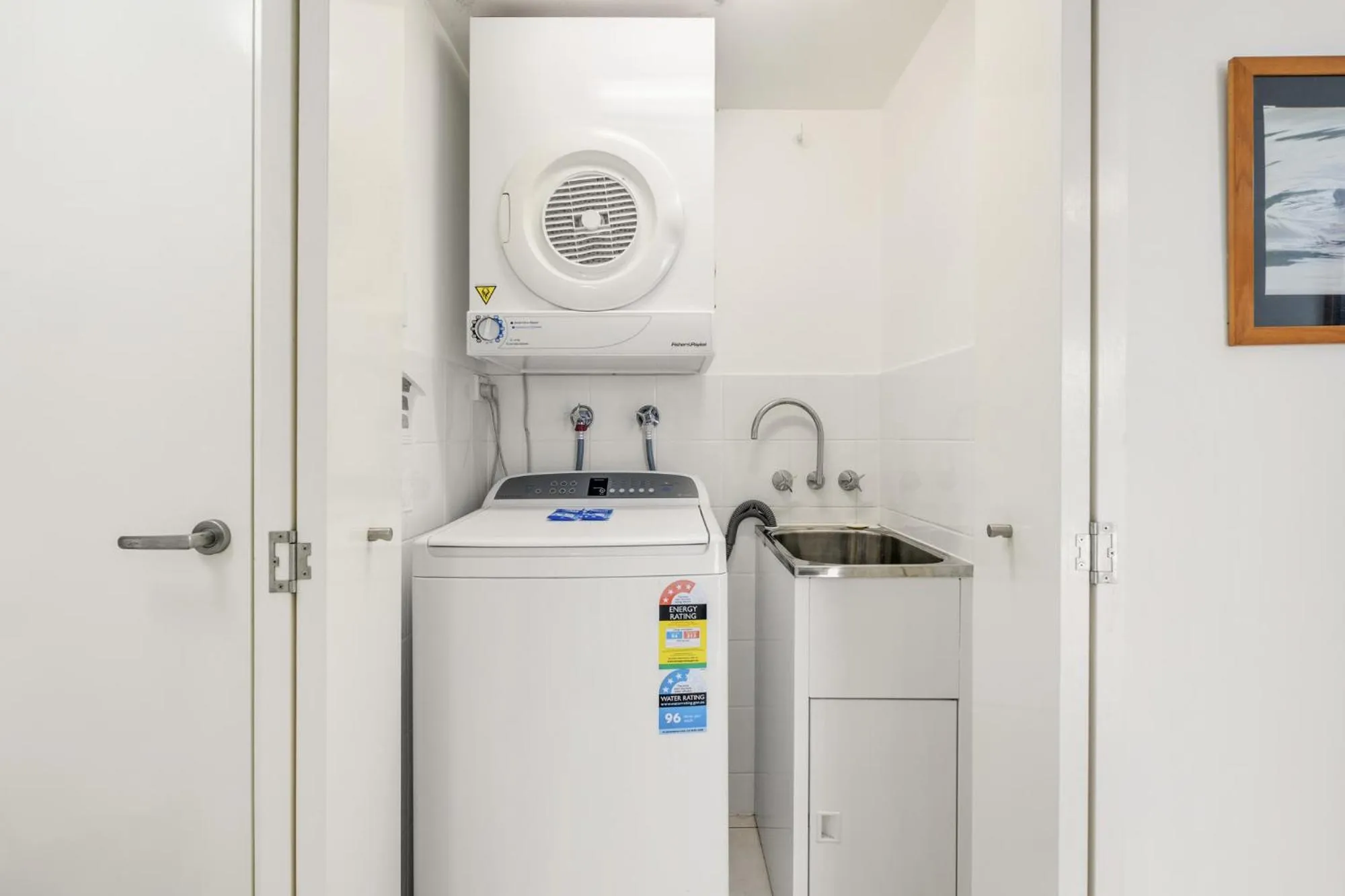 washing machine in Tingeera Beachfront Apartments