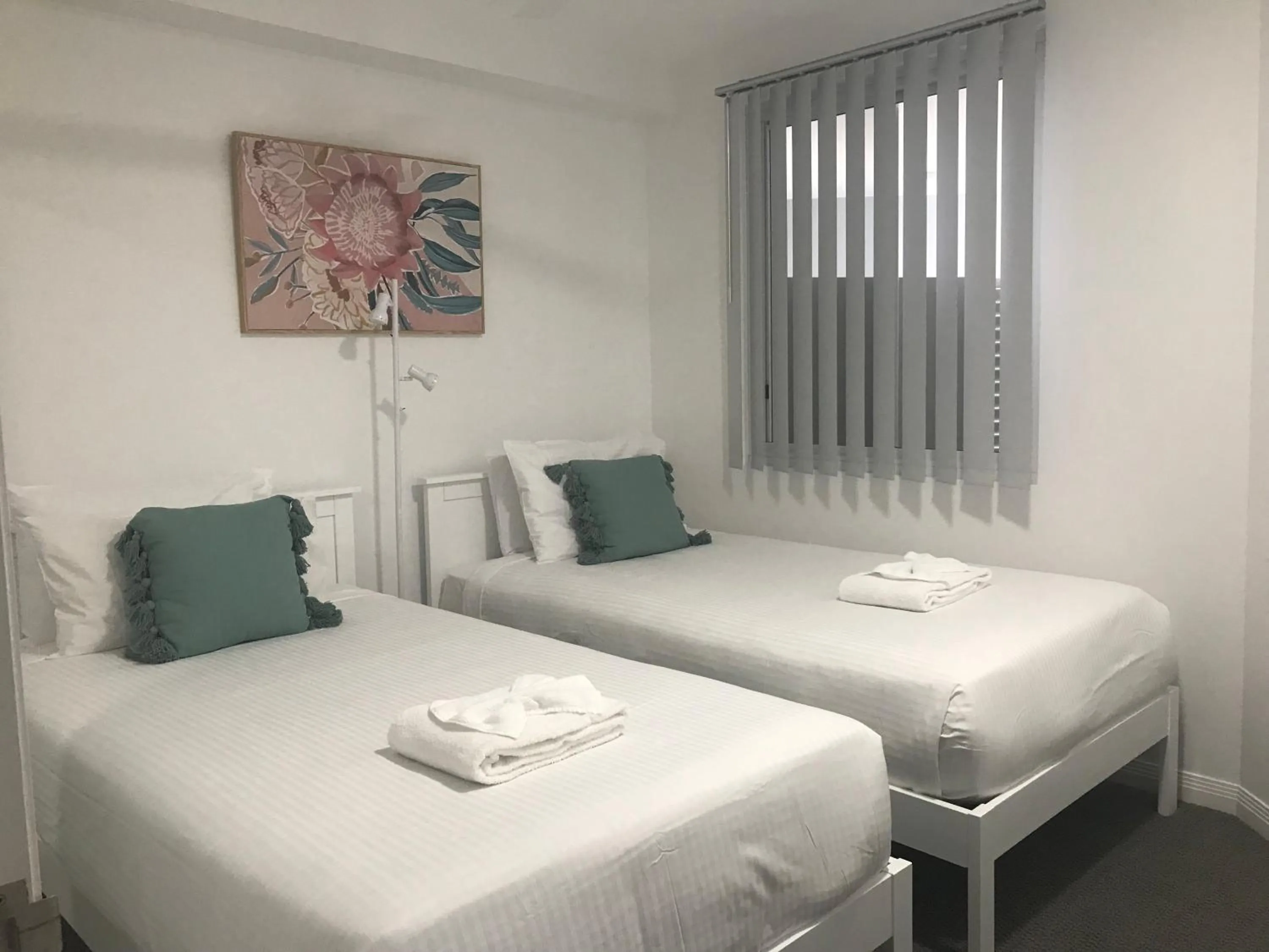 Bed in Tingeera Beachfront Apartments