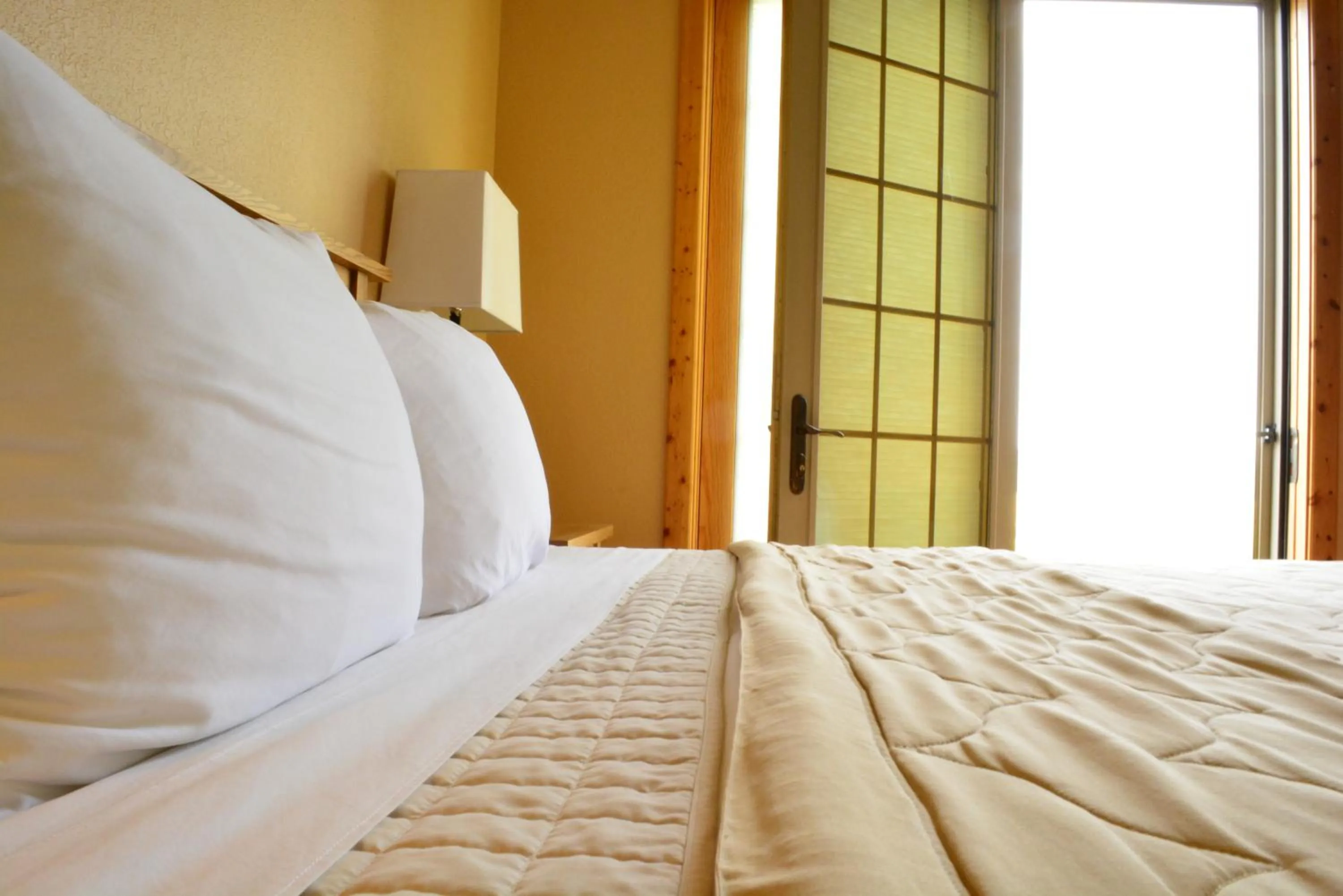 Bed in Gallatin River Lodge