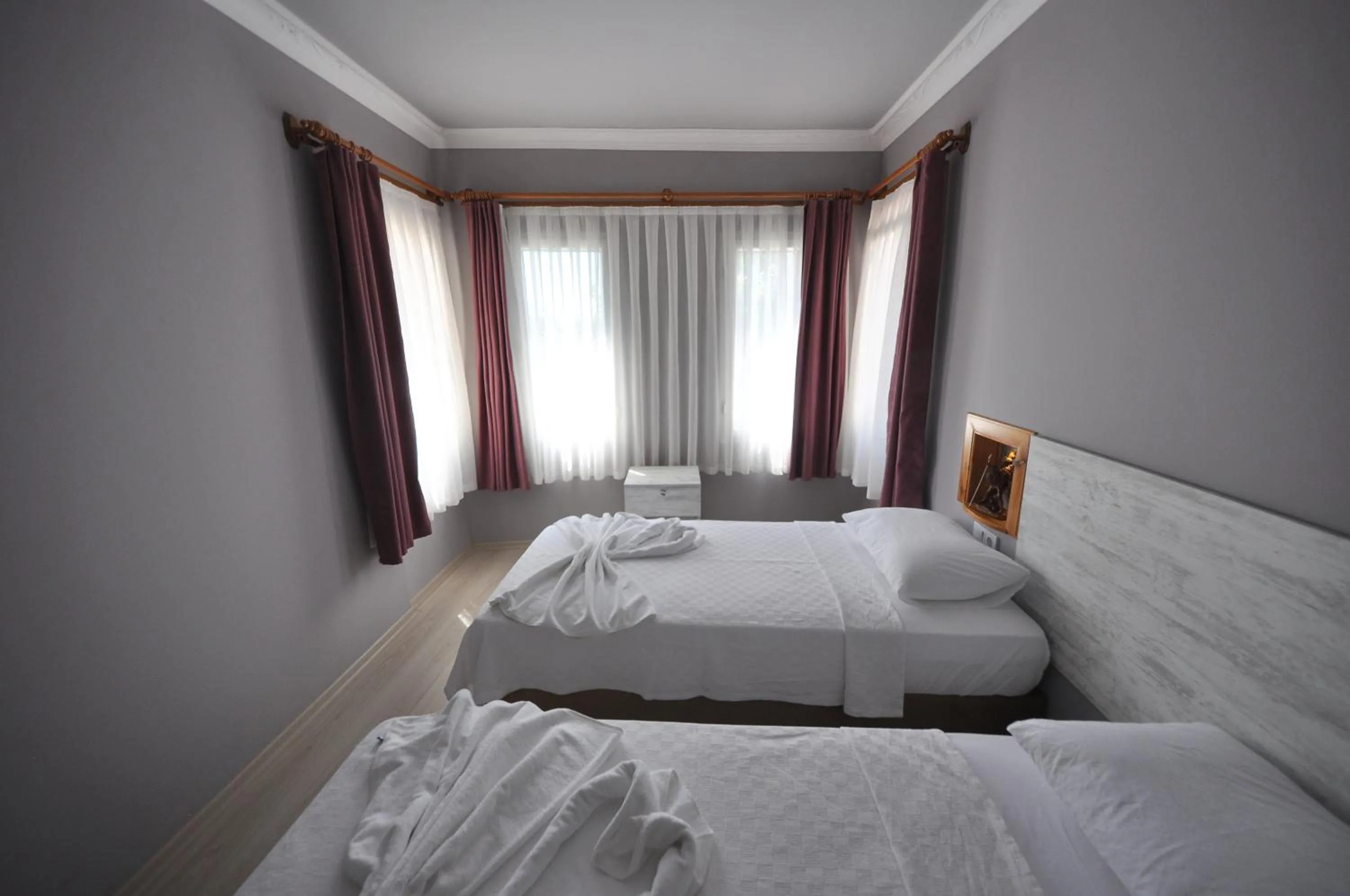 Bed in Queen Bee Hotel