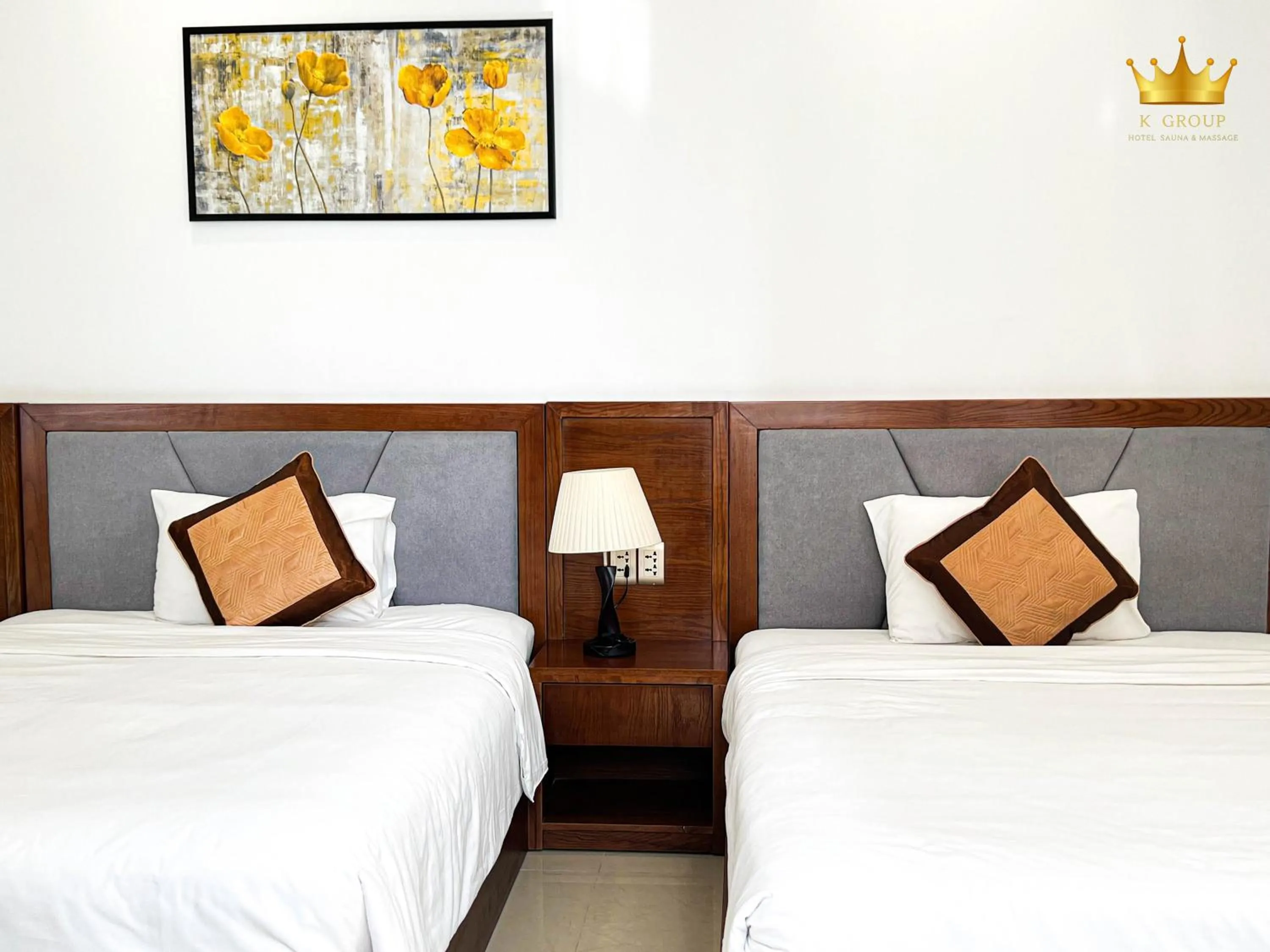 Bed in K Hotel Sauna and Massage