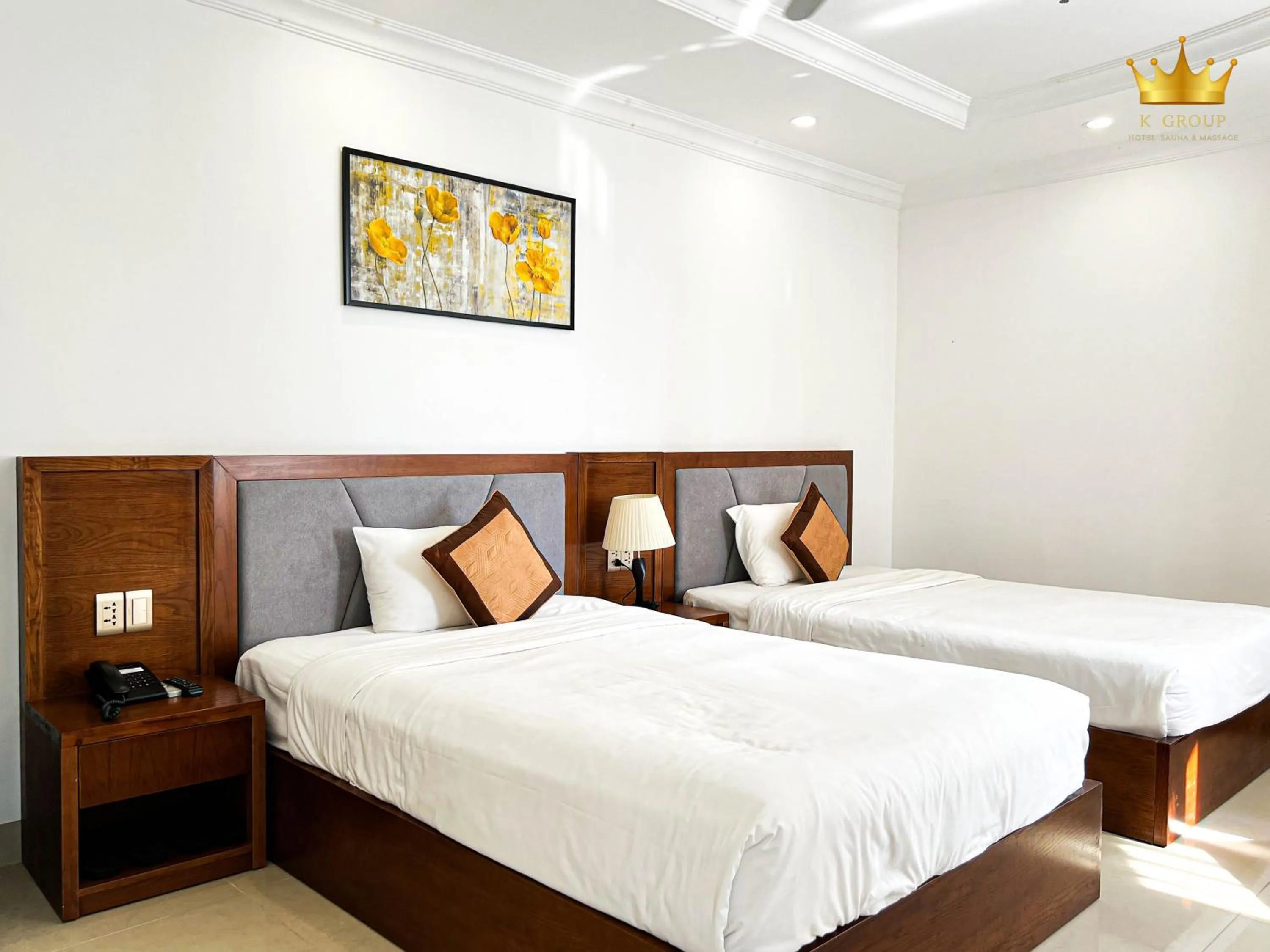 Bed in K Hotel Sauna and Massage