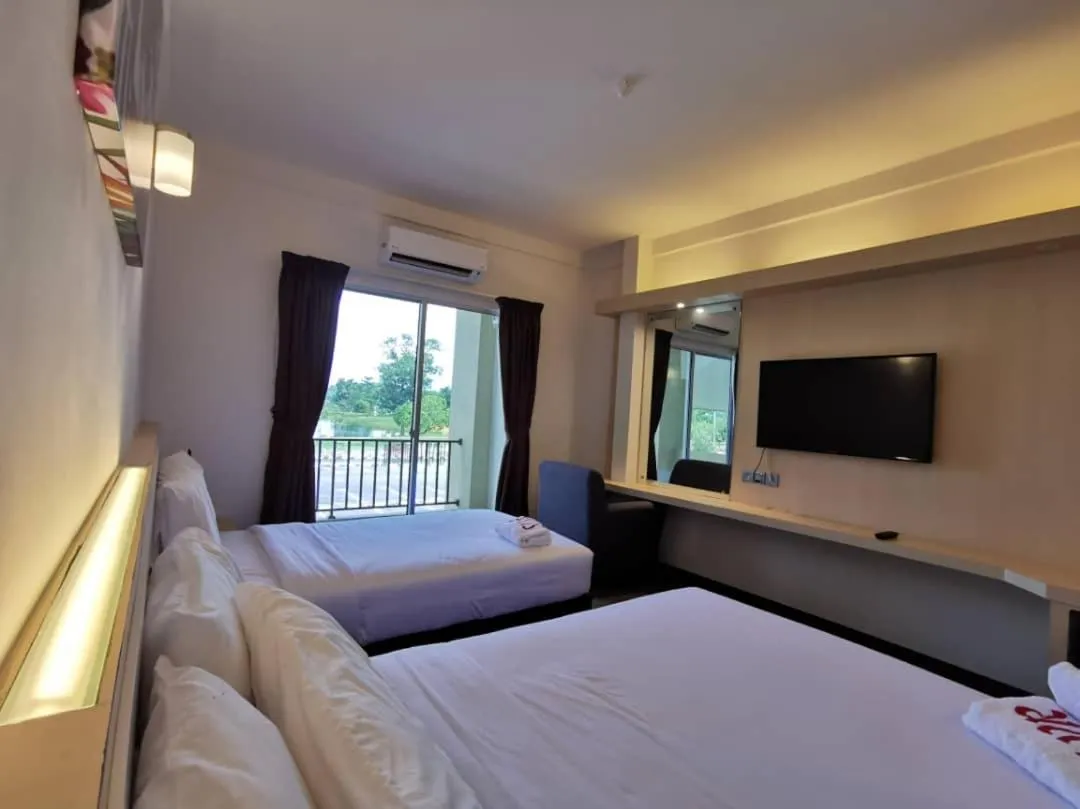 Communal lounge/ TV room, Bed in SERDANG LAKE VIEW RESORT