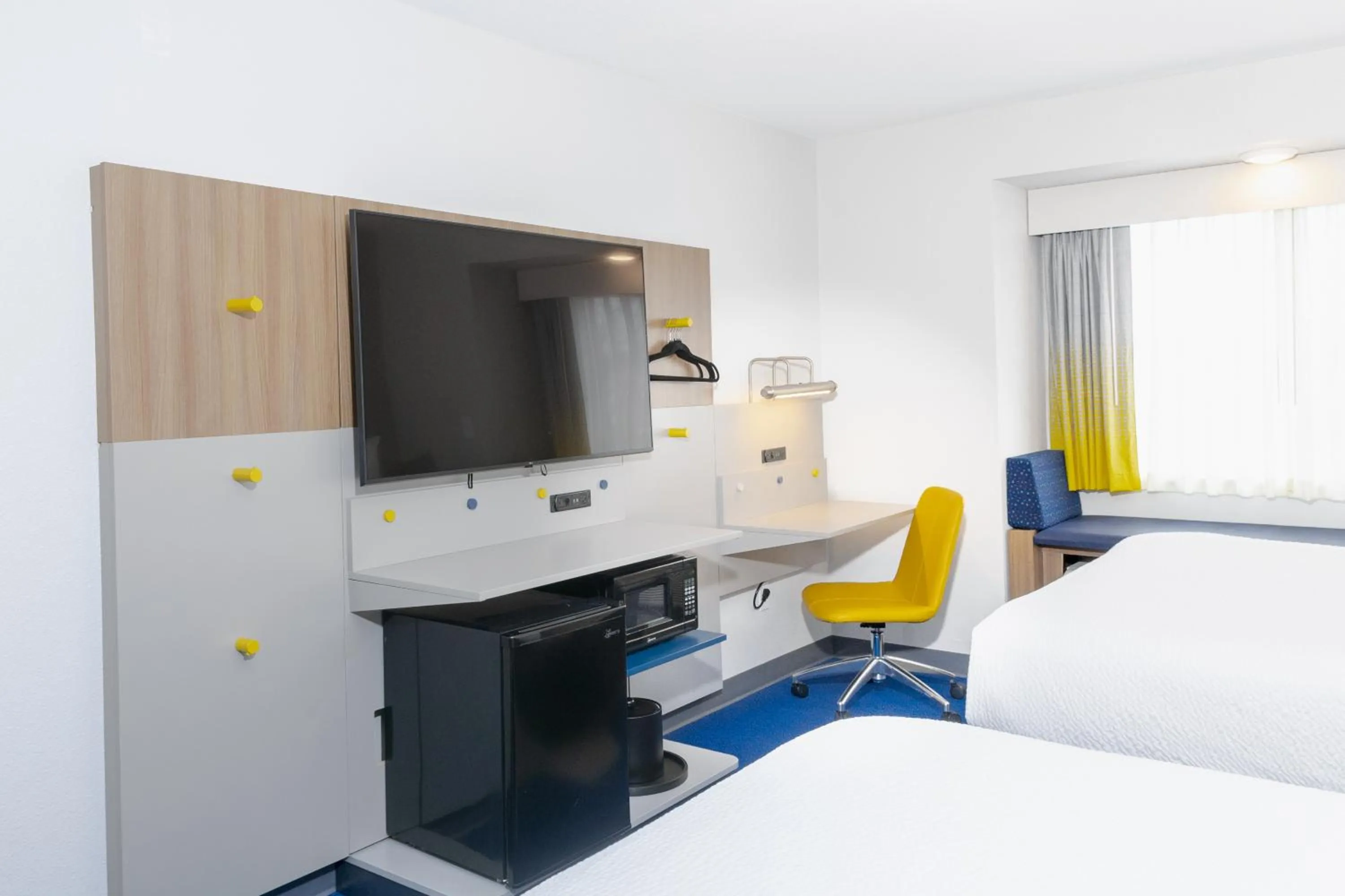 Bed in Microtel Inn & Suites by Wyndham Wellsville