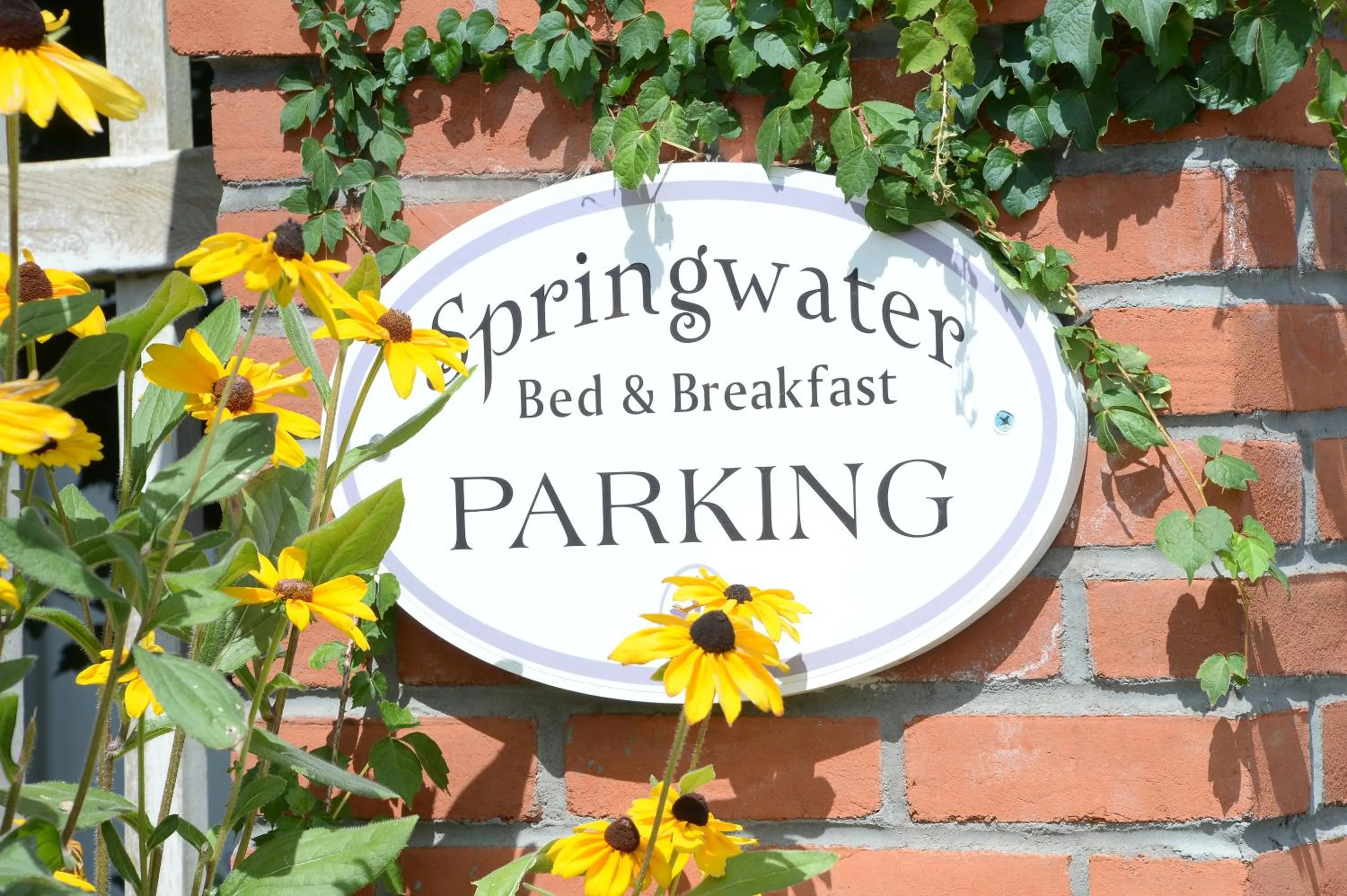 Property logo or sign in The Springwater Bed and Breakfast