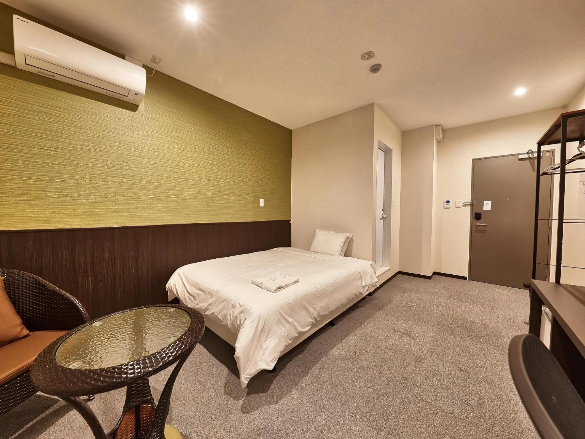 Living room, Bed in Crown Hotel Okinawa Annex