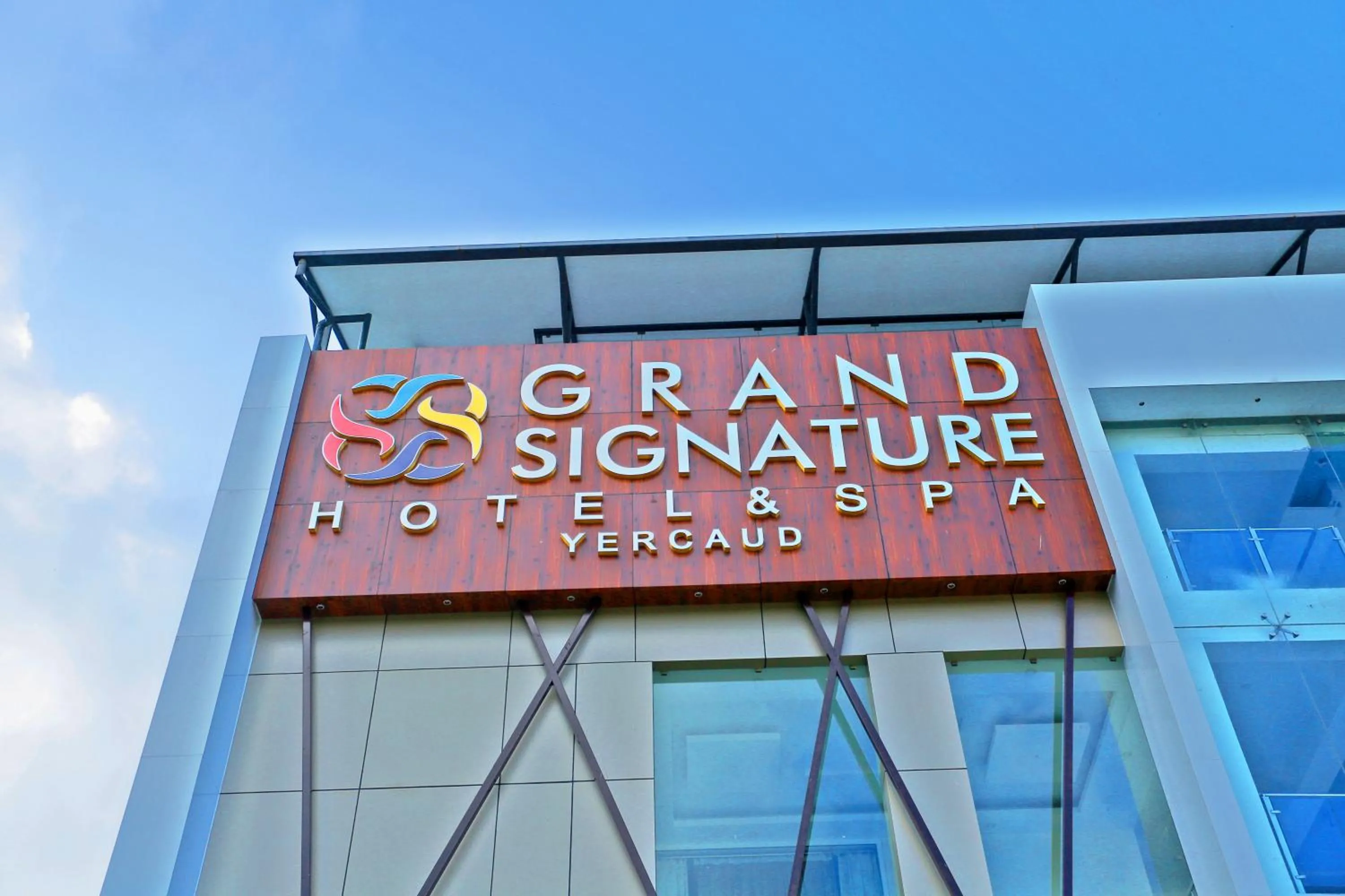 Property logo or sign in Grand Signature Hotel & spa