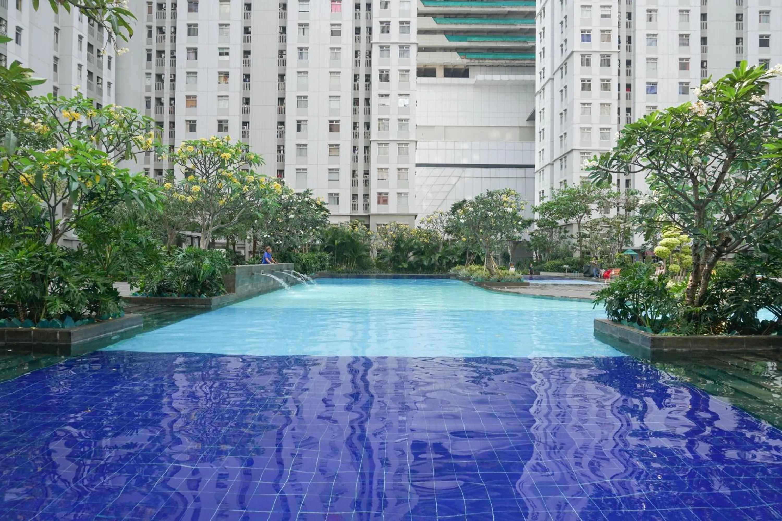 Spacious 2BR Green Bay Pluit Apartment By Travelio