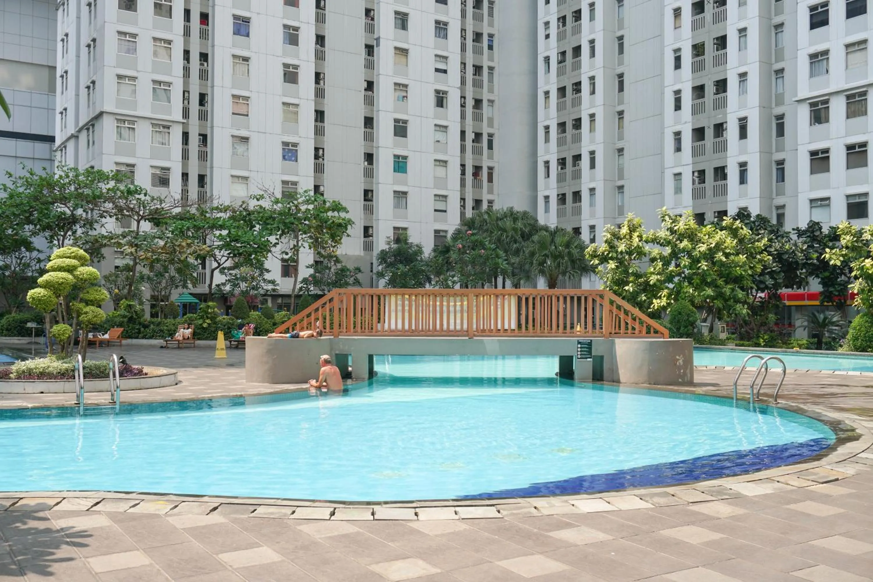 Spacious 2BR Green Bay Pluit Apartment By Travelio