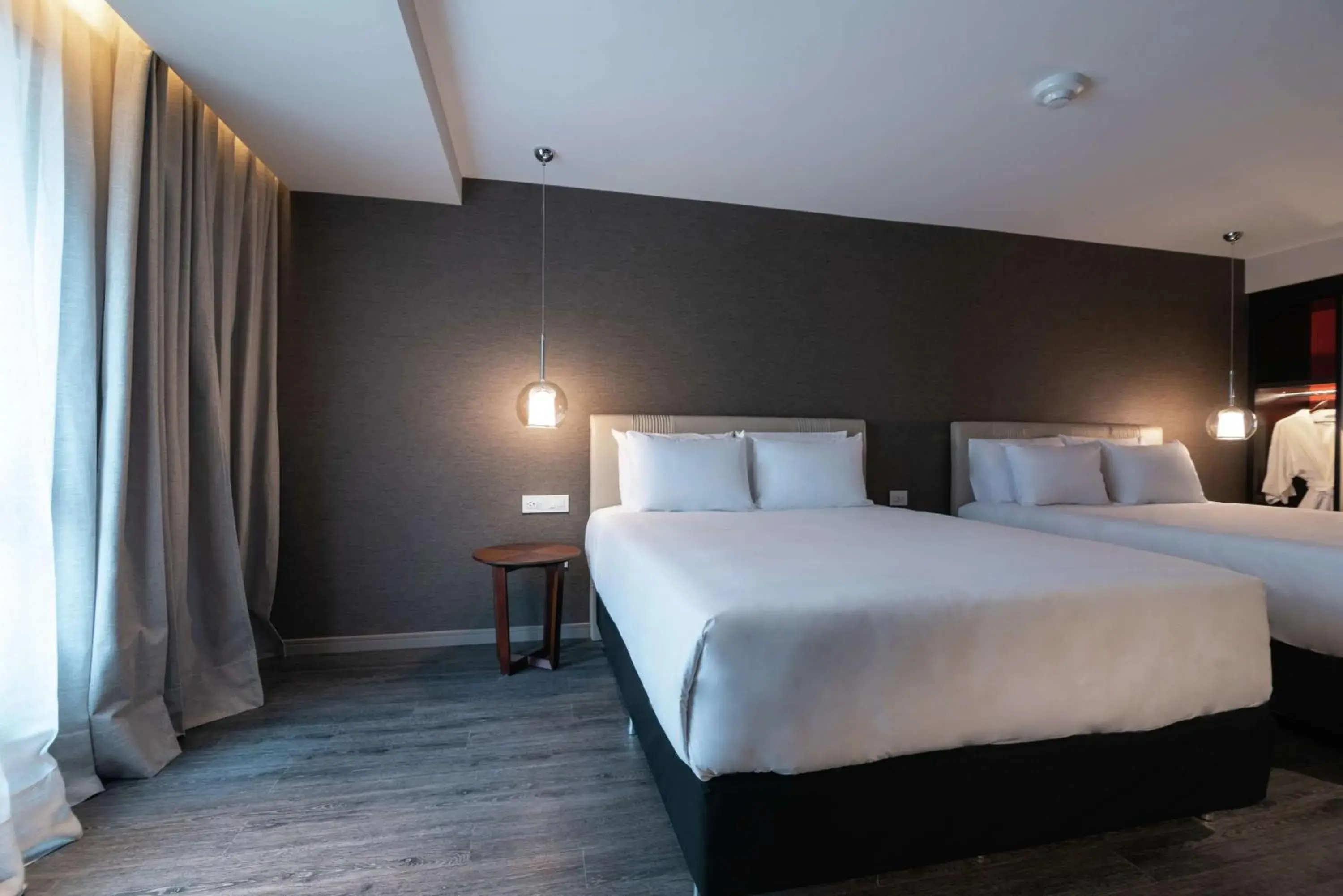 Queen Room with Two Queen Beds and Roll-In Shower - Mobility and Hearing Access in Soro Montevideo, Curio Collection By Hilton Queen Room with Two Queen Beds and Roll-In Shower - Mobility and Hearing Access in Soro Montevideo, Curio Collection By Hilton